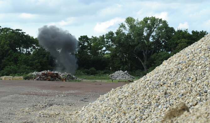 A plume of smoke rises into the air after 22nd Civil Engineer Squadron explosive ordnance disposal technicians detonate munitions in order to dispose of an artillery projectile Aug. 8, 2016, in Marion County, Kan. The Marion County Sherriff’s Department contacted McConnell’s EOD team after an individual turned in a potentially dangerous explosive device. (U.S. Air Force photo/Senior Airman Tara Fadenrecht)