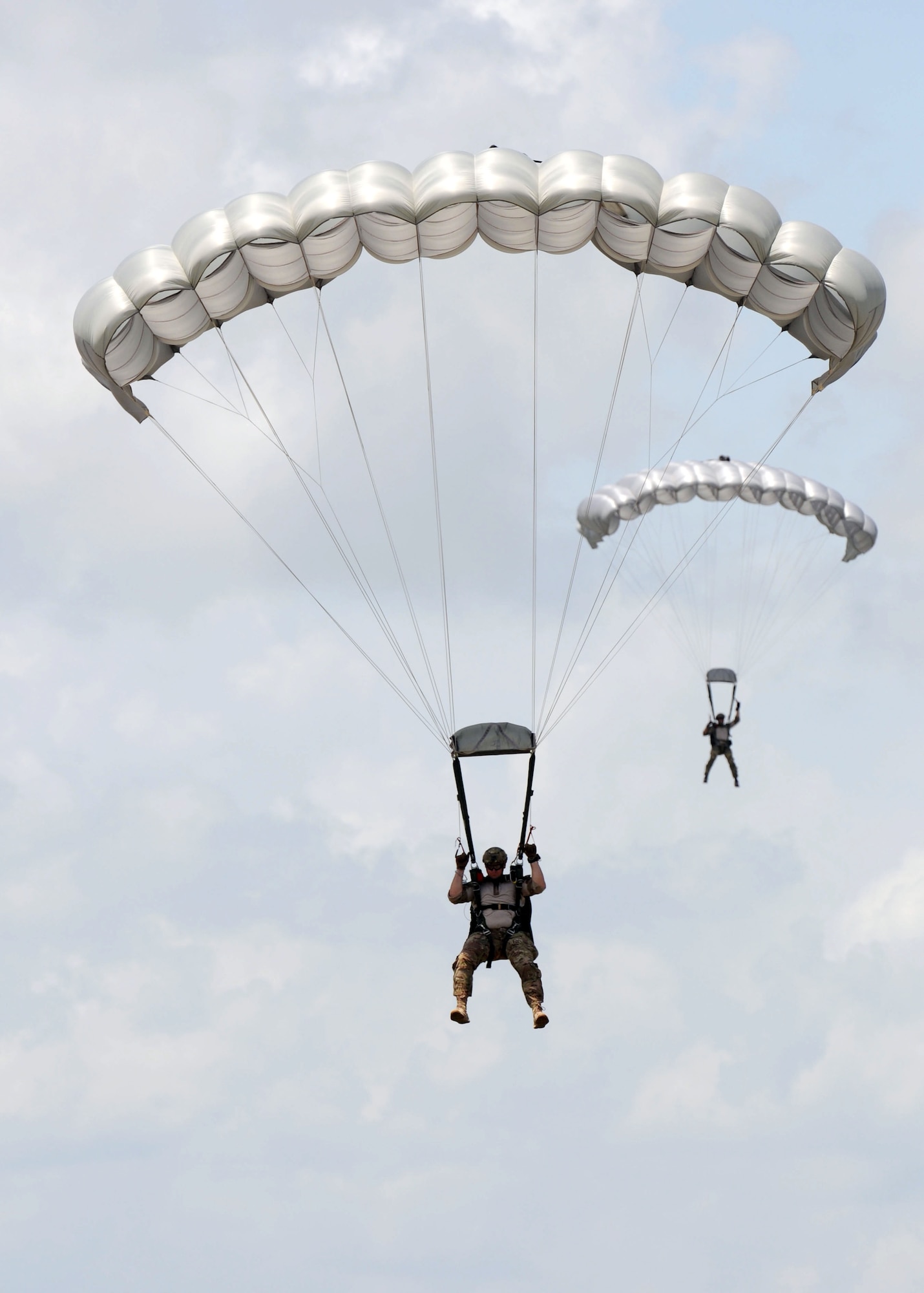 Special Tactics Airmen from the 720th Special Tactics Group, Hurlburt Field, Fla., complete a successful parachute landing on the flight line during a free fall training exercise July 28, 2016, on Keesler Air Force Base, Miss. The Air Force's special operations ground force uses freefall as an infiltration method to access areas where aircraft cannot land. (U.S. Air Force photo by Kemberly Groue/Released)
