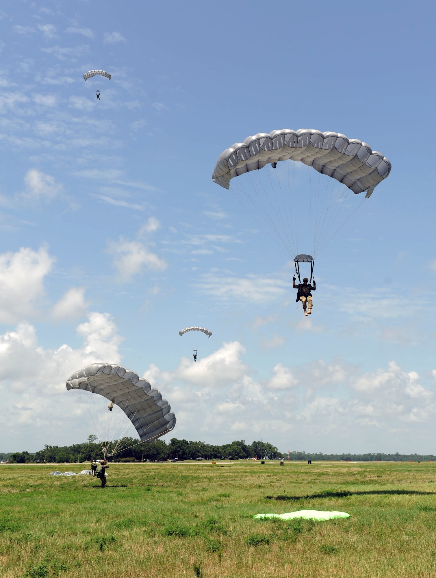 Special Tactics Airmen from the 720th Special Tactics Group, Hurlburt Field, Fla., complete a successful parachute landing on the flight line during a free fall training exercise July 28, 2016, on Keesler Air Force Base, Miss. The Air Force's special operations ground force uses freefall as an infiltration method to access areas where aircraft cannot land. (U.S. Air Force photo by Kemberly Groue/Released)
