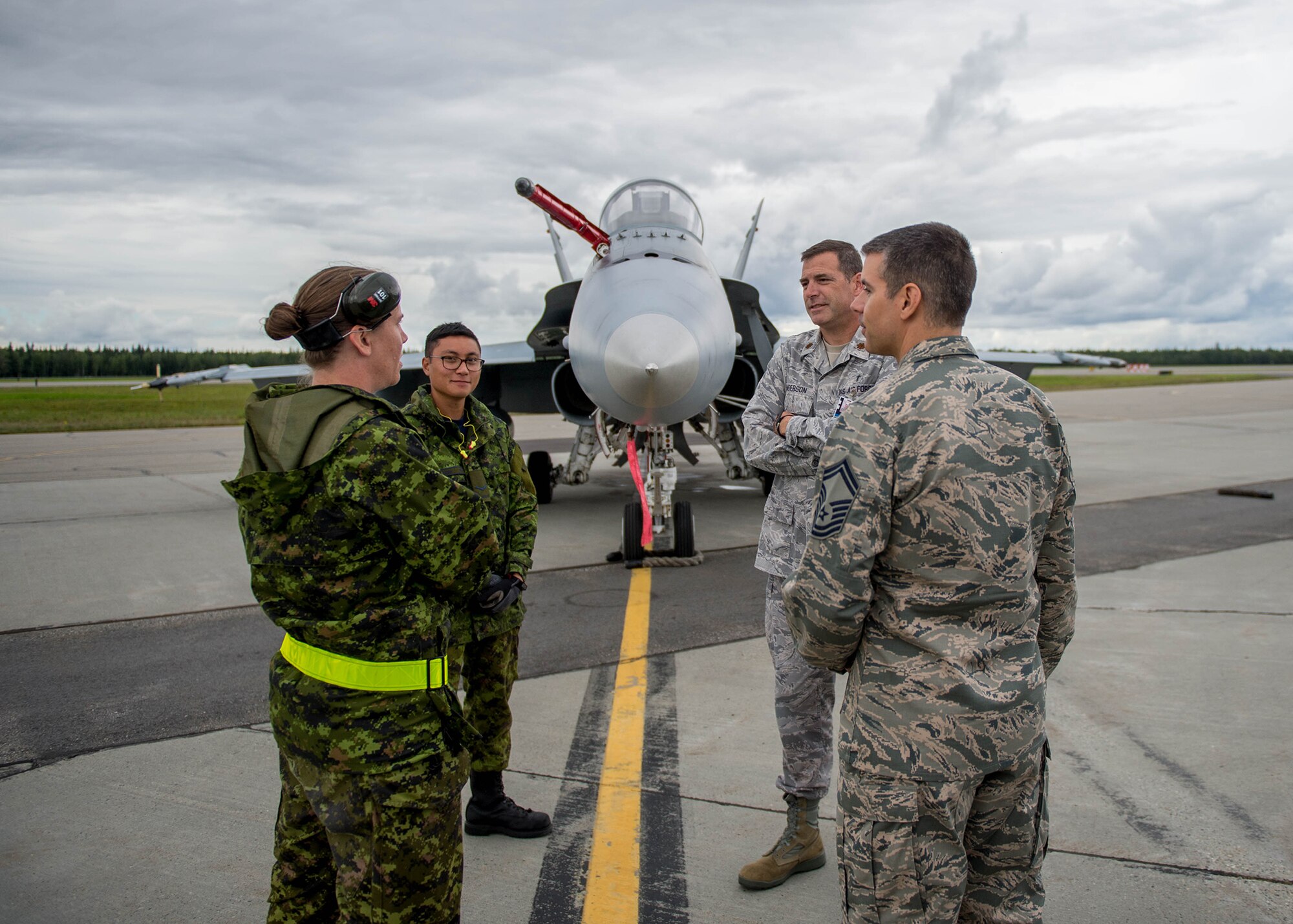 U.S. Air Force Senior Master Sgt. Michael Taylor, the Pacific Air Forces chaplain assistant functional manager, and Maj. Brian Anderson, the 354th Fighter Wing command chaplain, meet with Royal Canadian Air Force airmen from, Canadian Forces Base Cold Lake, Alberta, Aug. 9, 2016, who are participating in RED FLAG-Alaska 16-3 at Eielson Air Force Base, Alaska. This exercise provides unique opportunities to integrate various forces into joint, coalition and multilateral training from simulated forward operating bases. (U.S. Air Force photo by Staff Sgt. Shawn Nickel)