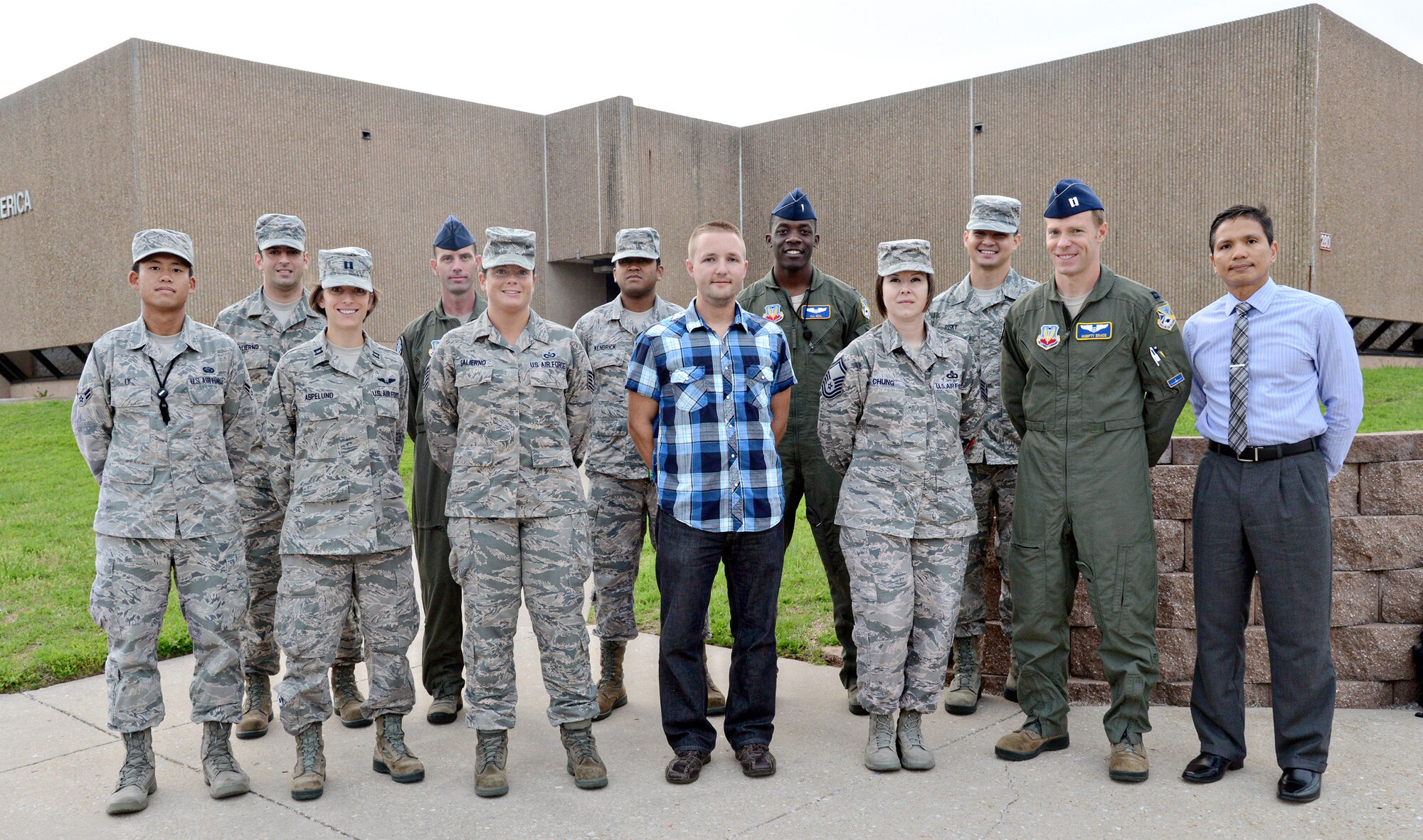 Team Tinker Marathon Team members include, back row from left, Tech. Sgt. Dominic Salierno, Master Sgt. Jason Meermans, Staff Sgt. Vance Kendrick, Lt. Denzel Neal and Senior Airman Michael Risky. Front row from left, Airman 1st Class Daniel Ly, Capt. Chelsea Aspelund, Tech. Sgt. Crystal Salierno, Dustin Gier, Senior Master Sgt. Kristie Chung, Capt. Marshall Brace and Hank Reyes. (Air Force photo by Kelly White)