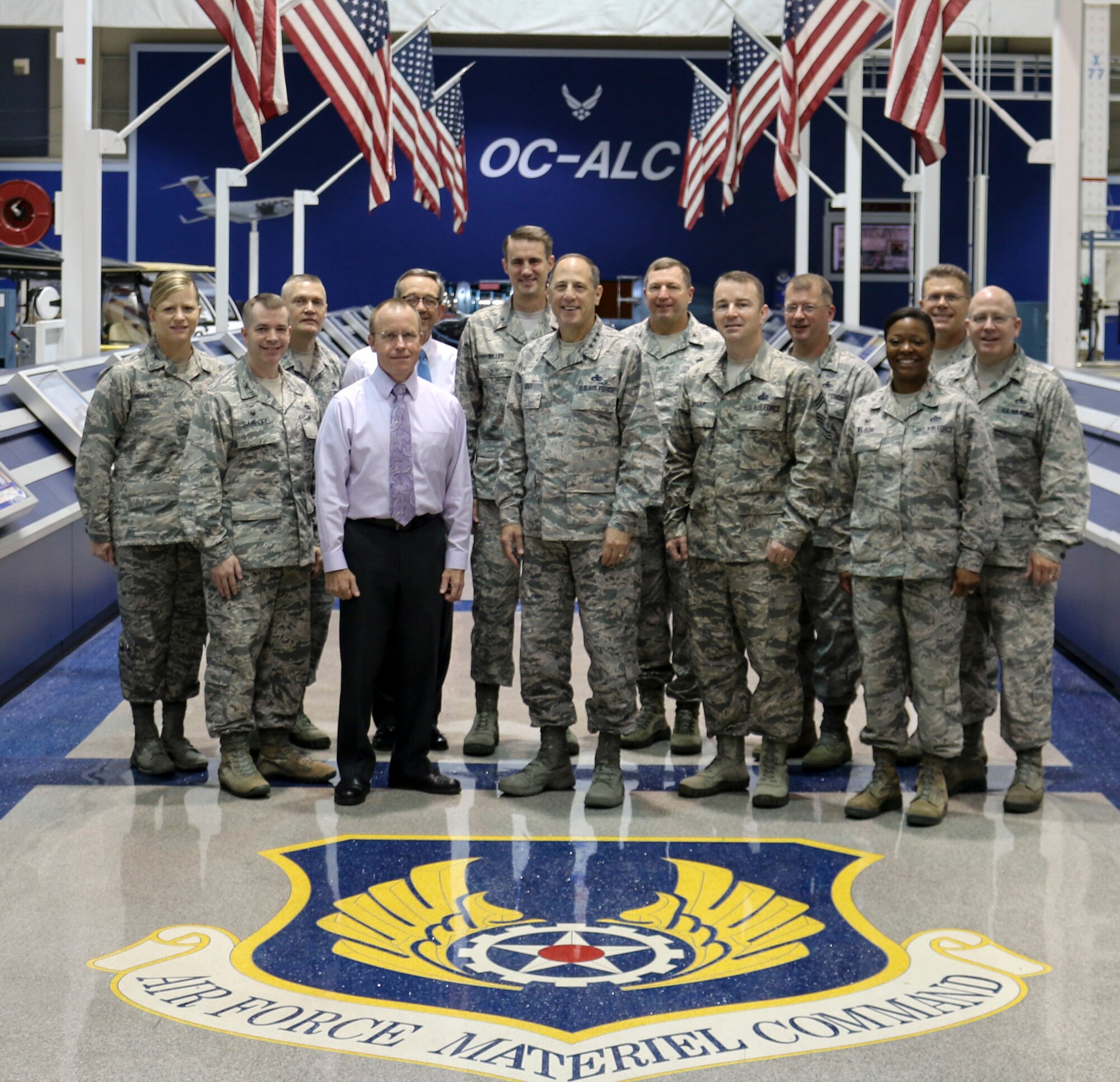 Lt. Gen. Lee K. Levy II, center, Air Force Sustainment Center commander, is surrounded by commanders and senior leaders from subordinate units brought together for a Commanders Conference Aug. 3-4 at Tinker. General Levy discussed and took inputs from the commanders on the AFSC Strategic Plan in a value-added environment where he said, “All the new commanders and leaders on the AFSC staff got to know each other and build a professional relationship that will pay dividends as they work together to support the Air Force mission and the Airmen of the AFSC.” Pictured are, front row from left, Col. David Sanford, commander, 635th Supply Chain Operations Wing, Scott AFB, Ill.; Jeff Allen, AFSC executive director; General Levy; Chief Master Sgt. Gary Sharp, AFSC command chief master sergeant; and Col. Stephanie Wilson, commander, 72nd Air Base Wing. Back row, from left, Col. Jennifer Hammerstedt, commander, 75th Air Base Wing, Hill AFB, Utah; Brig. Gen. Walter Lindsley, former commander, Warner Robins Air Logistics Complex; Frank Washburn, director, 448th Supply Chain Management Wing; Brig. Gen. Tom Miller, AFSC vice commander; Brig. Gen. Mark Johnson, commander, Oklahoma City Air Logistics Complex; Col. John Kubinec, WR-ALC commander; Brig. Gen. Steve Bleymaier, commander, Ogden Air Logistics Complex; and Col. Jeffrey King, commander, 78th Air Base Wing, Robins AFB, Ga. (Air Force photo by Abraham Martinez)