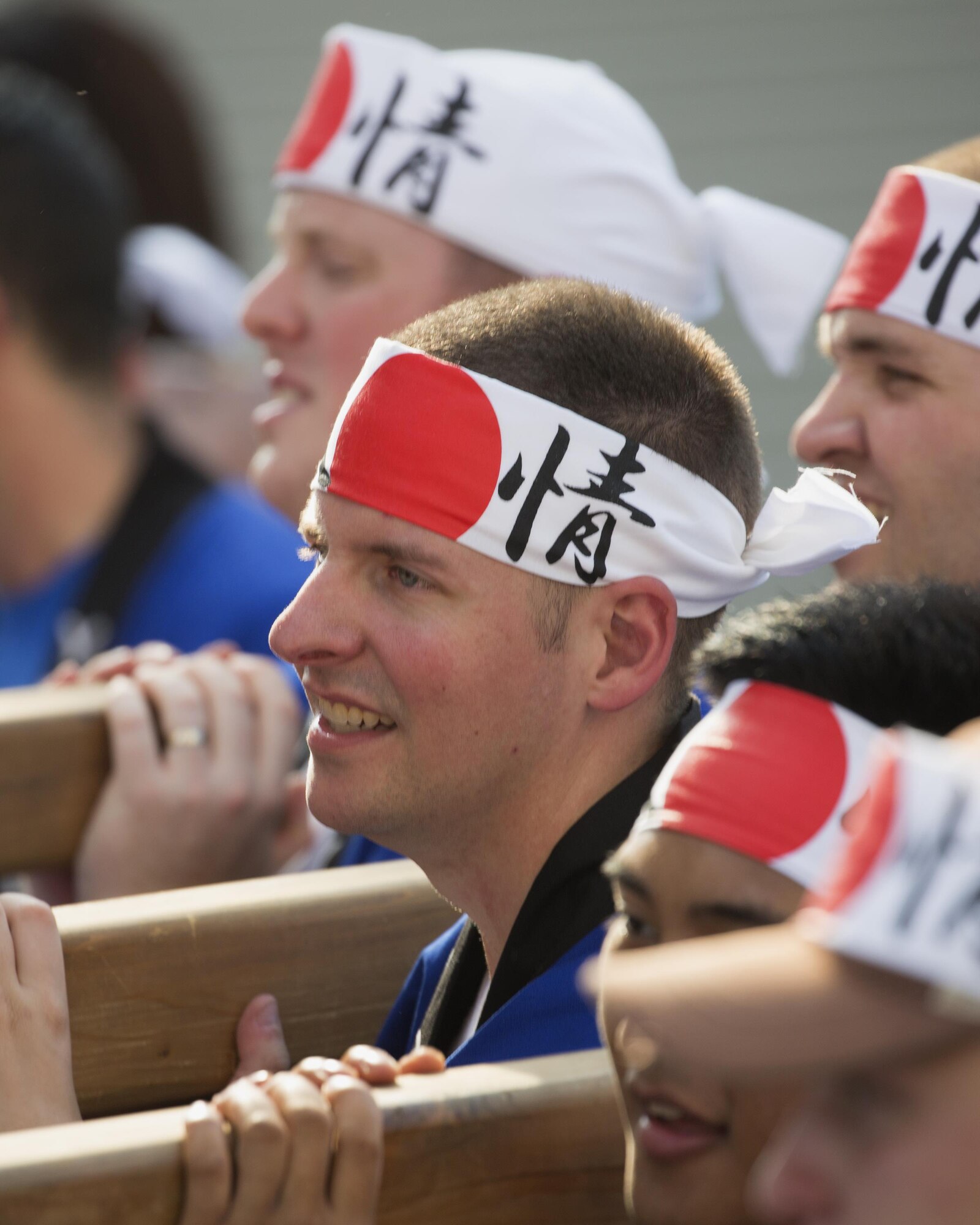 Airmen from Yokota Air Base carry the wing mikoshi during the 66th annual Fussa Tanabata Festival in Fussa City, Japan, Aug. 5, 2016. The festival gave Yokota members an opportunity to build friendships with the local community while experiencing Japanese culture. (U.S. Air Force photo by Yasuo Osakabe/Released)