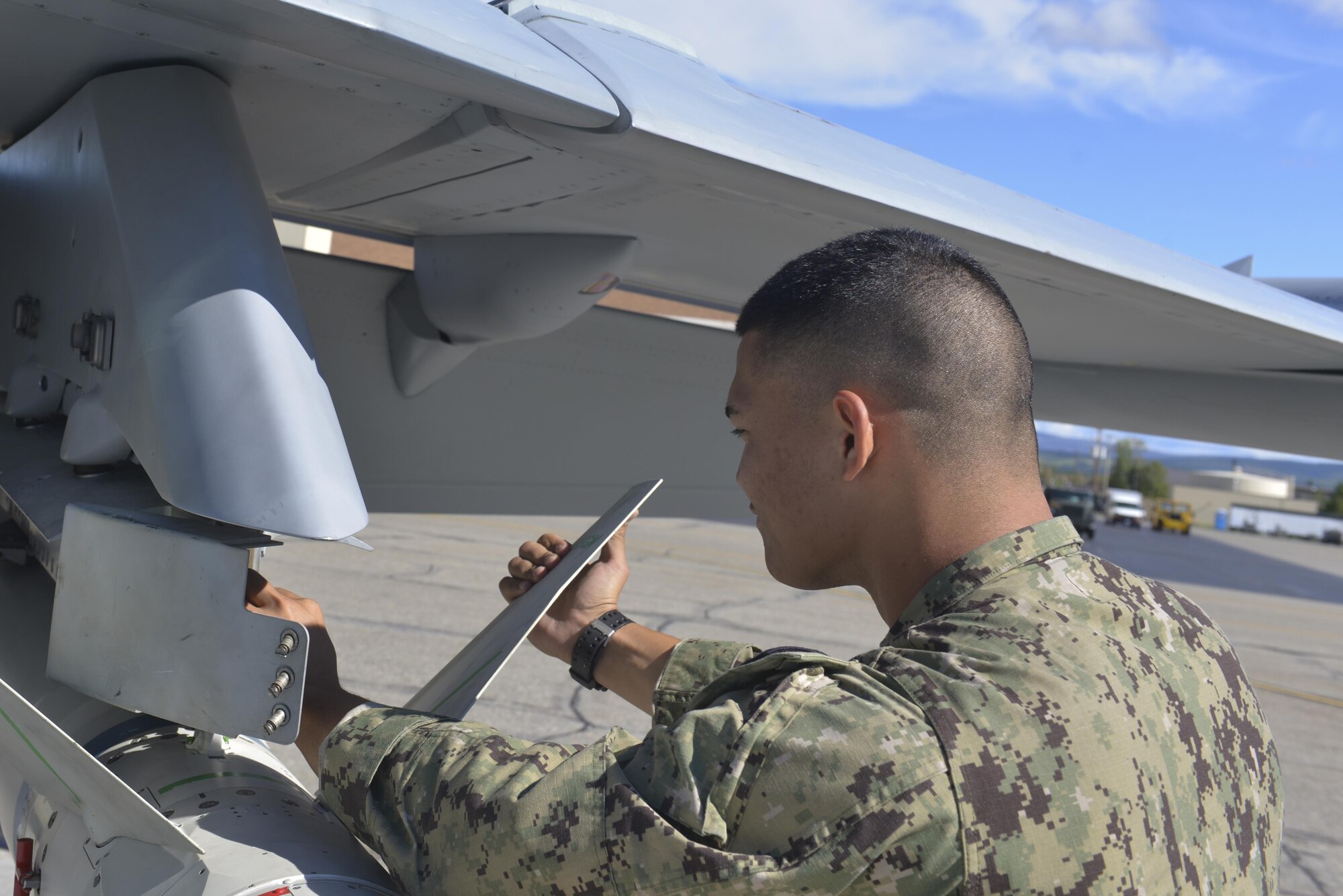 U.S. Navy Seaman Hiapo McCandless, an aviation ordnanceman assigned to Electronic Attack Squadron 135, Naval Air Station Whidbey Island, Wash., works on an AGM-88E missile Aug. 10, 2016, during RED FLAG-Alaska 16-3, at Eielson Air Force Base, Alaska. The AGM-88E is an advanced anti-radiation guided missile; its primary use is for targeting enemy air defenses. (U.S. Air Force photo by Airman Isaac Johnson)
