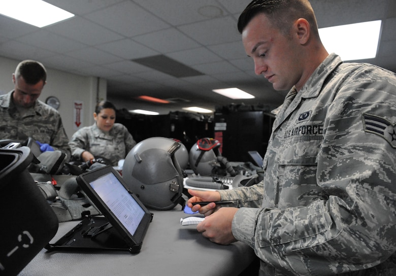 U.S. Air Force Senior Airman Brandon Perry, an Aircrew Flight Equipment technician, assigned to the 509th Operation Support Squadron, reviews technical orders at Andersen Air Force Base, Guam, Aug. 9, 2016. Each AFE member conducts the 134 item inspection ensuring there are no discrepancies before pilots don their gear. Members from Whiteman Air Force Base, Mo., along with three B-2s, deployed here in the Indo-Asia-Pacific to conduct U.S. Strategic Command-led air operations, providing leaders with deterrent options to maintain regional stability. (U.S. Air Force photo by Tech. Sgt. Miguel Lara III)
