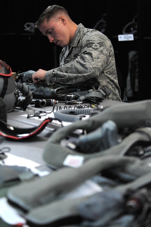 U.S. Air Force Senior Airman Adam Clapp, an Aircrew Flight Equipment technician, assigned to the 509th Operation Support Squadron, tailors a life preserver on an air ace vest, at Andersen Air Force Base, Guam, Aug. 9, 2016. Approximately 200 Airmen and three B-2s from Whiteman Air Force Base, Mo., deployed here in support of U.S. Strategic Command’s Bomber Assurance and Deterrence mission. (U.S. Air Force photo by Tech. Sgt. Miguel Lara III)