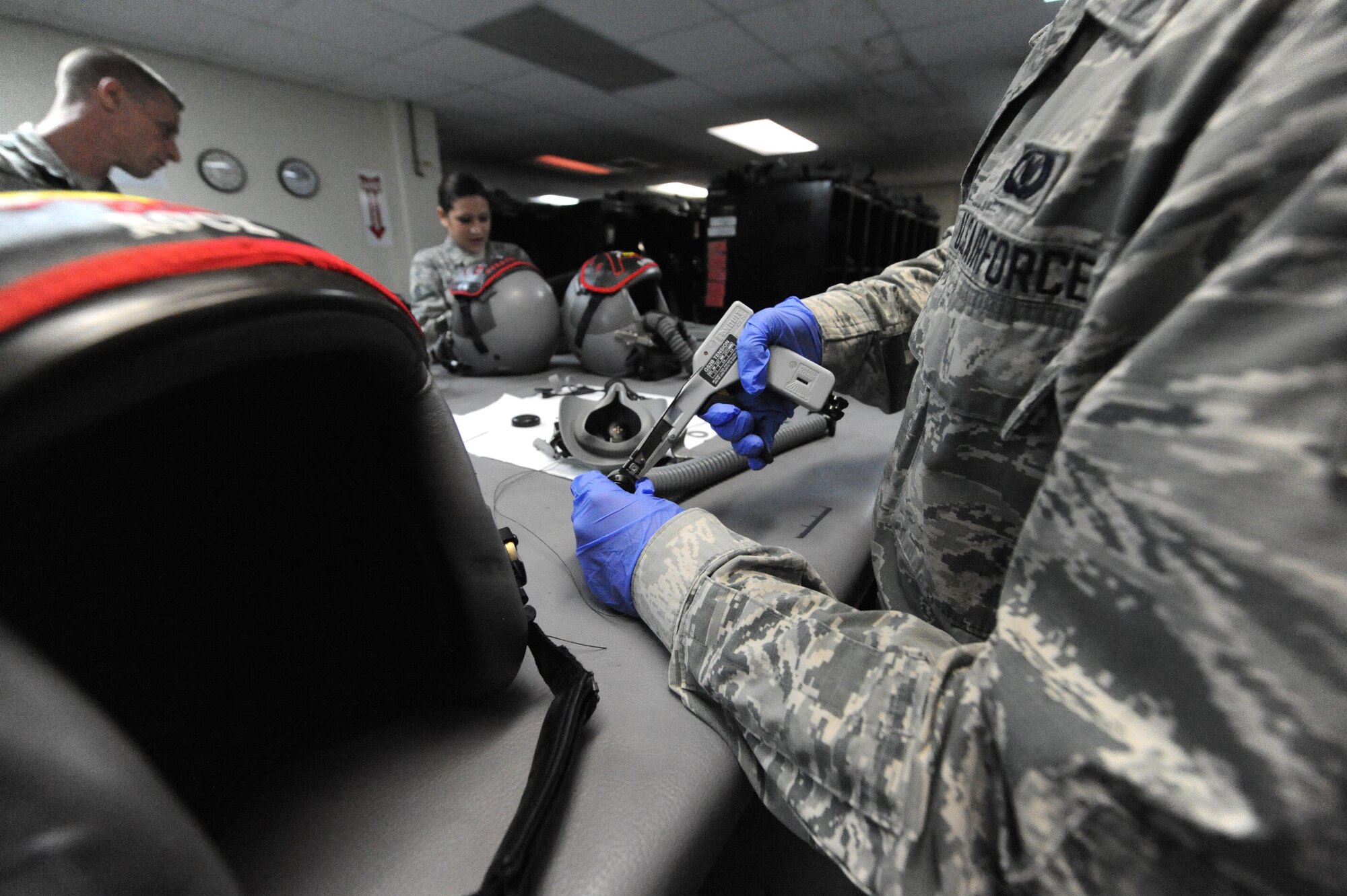 U.S. Air Force Senior Airman Brandon Perry, an Aircrew Flight Equipment technician, assigned with the 509th Operation Support Squadron, performs preventative maintenance on an oxygen supply tube, at Andersen Air Force Base, Guam, Aug. 9, 2016. Approximately 200 Airmen and three B-2s from Whiteman Air Force Base, Mo., deployed here in support of U.S. Strategic Command’s Bomber Assurance and Deterrence mission. (U.S. Air Force photo by Tech. Sgt. Miguel Lara III)