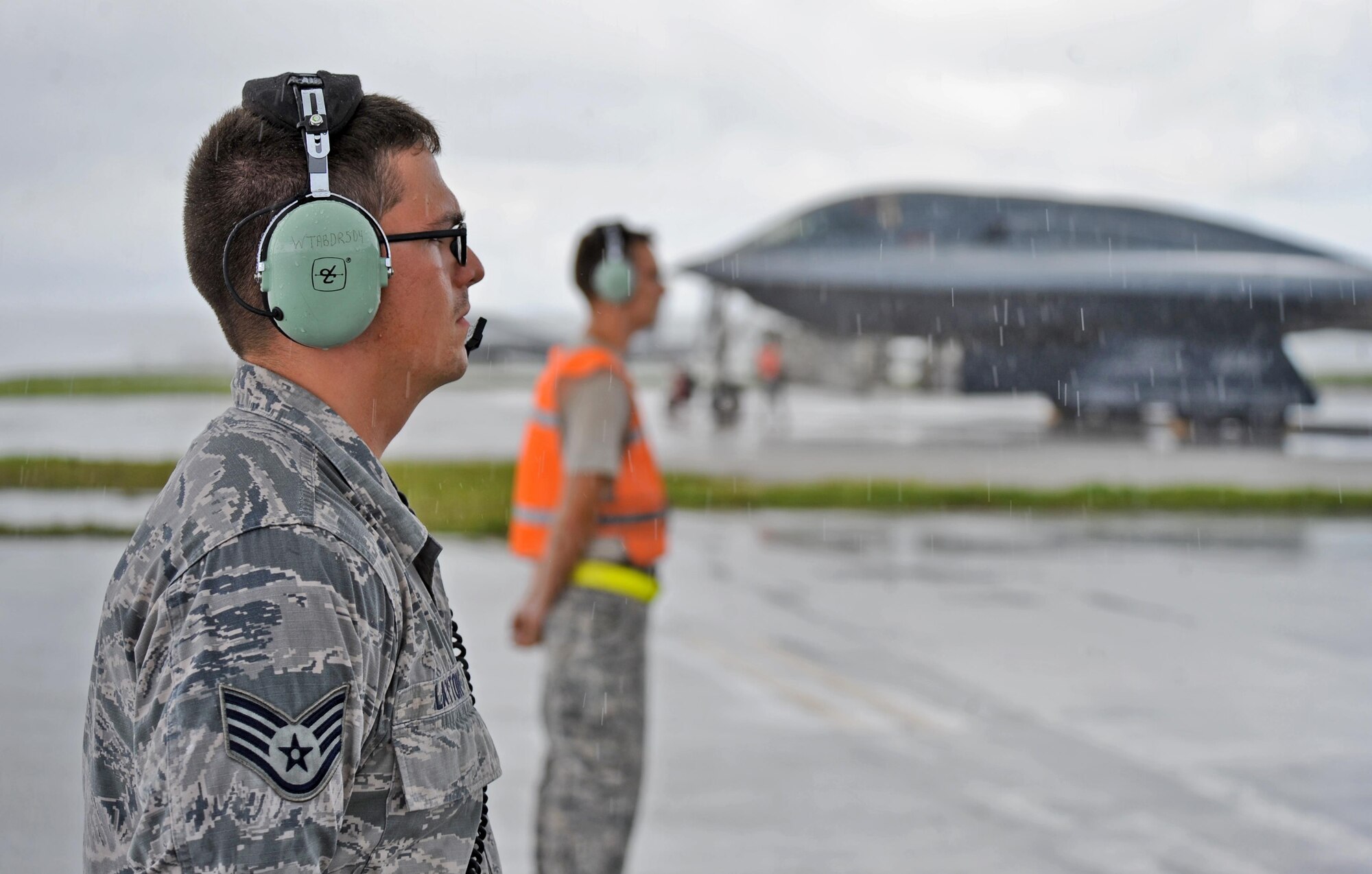 U.S. Air Force Staff Sgt. Joshua Layton (left), an assistant dedicated crew chief, and Staff Sgt. Matthew Helms, a dedicated crew chief, both assigned to the 509th Aircraft Maintenance Squadron, communicate pre-flight instructions with a B-2 Spirit pilot prior to take off at Andersen Air Force Base, Guam, Aug. 11, 2016. More than 200 Airmen and three B-2s deployed from Whiteman Air Force Base, Mo., to conduct local sorties and regional training and integrate with regional allies in support of Bomber Assurance and Deterrence missions. (U.S. Air Force photo by Tech. Sgt. Miguel Lara III)
