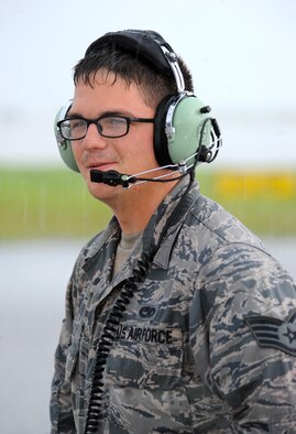U.S. Air Force Staff Sgt. Joshua Layton, an assistant dedicated crew chief assigned to the 509th Aircraft Maintenance Squadron, communicates pre-flight instructions with a B-2 Spirit pilot at Andersen Air Force Base, Guam, Aug. 11, 2016. Crew chiefs from Whiteman Air Force Base, Mo., deployed here to maintain a high state of readiness and proficiency, and demonstrate the U.S. commitment to regional security. (U.S. Air Force photo by Tech. Sgt. Miguel Lara III)