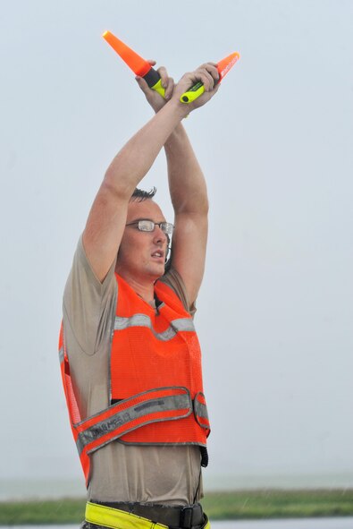 U.S. Air Force Staff Sgt. Matthew Helms, a dedicated crew chief assigned to the 509th Aircraft Maintenance Squadron, marshals a B-2 Spirit to the flightline at Andersen Air Force Base, Guam, Aug. 11, 2016. Airmen from the 509th AMXS and 131st Maintenance Group from Whiteman Air Force Base, Mo., deployed to the Indo-Asia-Pacific to maintain a high state of readiness and proficiency and demonstrate their ability to provide an always-ready global strike capability. (U.S. Air Force photo by Tech. Sgt. Miguel Lara III)