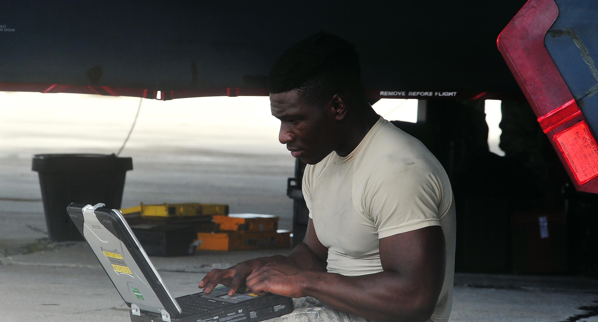 U.S. Air Force Staff Sgt. Elijah Fleming, a dedicated crew chief with the 509th Aircraft Maintenance Squadron from Whiteman Air Force Base, Mo., reviews technical orders Aug. 10, 2016 at Andersen Air Force Base, Guam.  Bomber missions strengthen capabilities by familiarizing aircrew with airbases and operations across the globe. (U.S. Air Force photo by Senior Airman Jovan Banks)