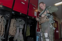 Capt. Benjamin Worrall, 67th Fighter Squadron operations flight commander, gears up for a flight Aug. 9, 2016, at Kadena Air Base, Japan. Worrall went through one of the phases of instructor pilot training where he prepared for a training session on offensive basic fighter maneuvering. (U.S. Air Force photo by Airman 1st Class Lynette M. Rolen) 