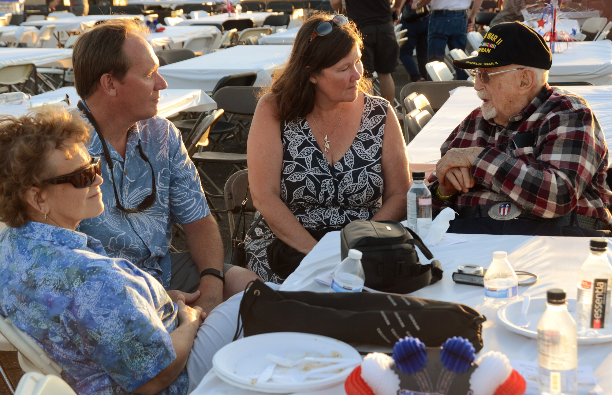 Fred Parrish, an original founding member of the Oregon Air National Guard, right, spends time with friends during the afterhours “All Call” celebration as part of the 75th Anniversary of the Oregon Air National Guard during the Oregon International Air Show, Hillsboro, Ore., Aug. 6, 2016. (U.S. Air National Guard photo by Tech. Sgt. John Hughel, 142nd Fighter Wing Public Affairs/Released).