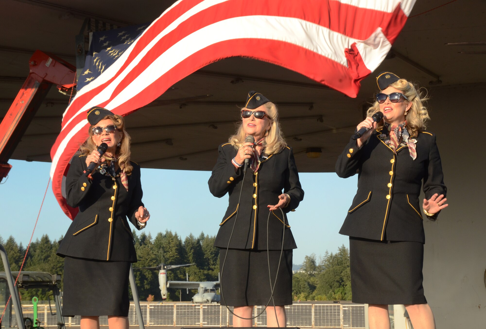 “The Ladies for Liberty,” sing and perform during the Oregon International Air Show afterhours “All Call” celebration as part of the 75th Anniversary of the Oregon Air National Guard during the Oregon International Air Show, Hillsboro, Ore., Aug. 6, 2016. (U.S. Air National Guard photo by Tech. Sgt. John Hughel, 142nd Fighter Wing Public Affairs/Released).