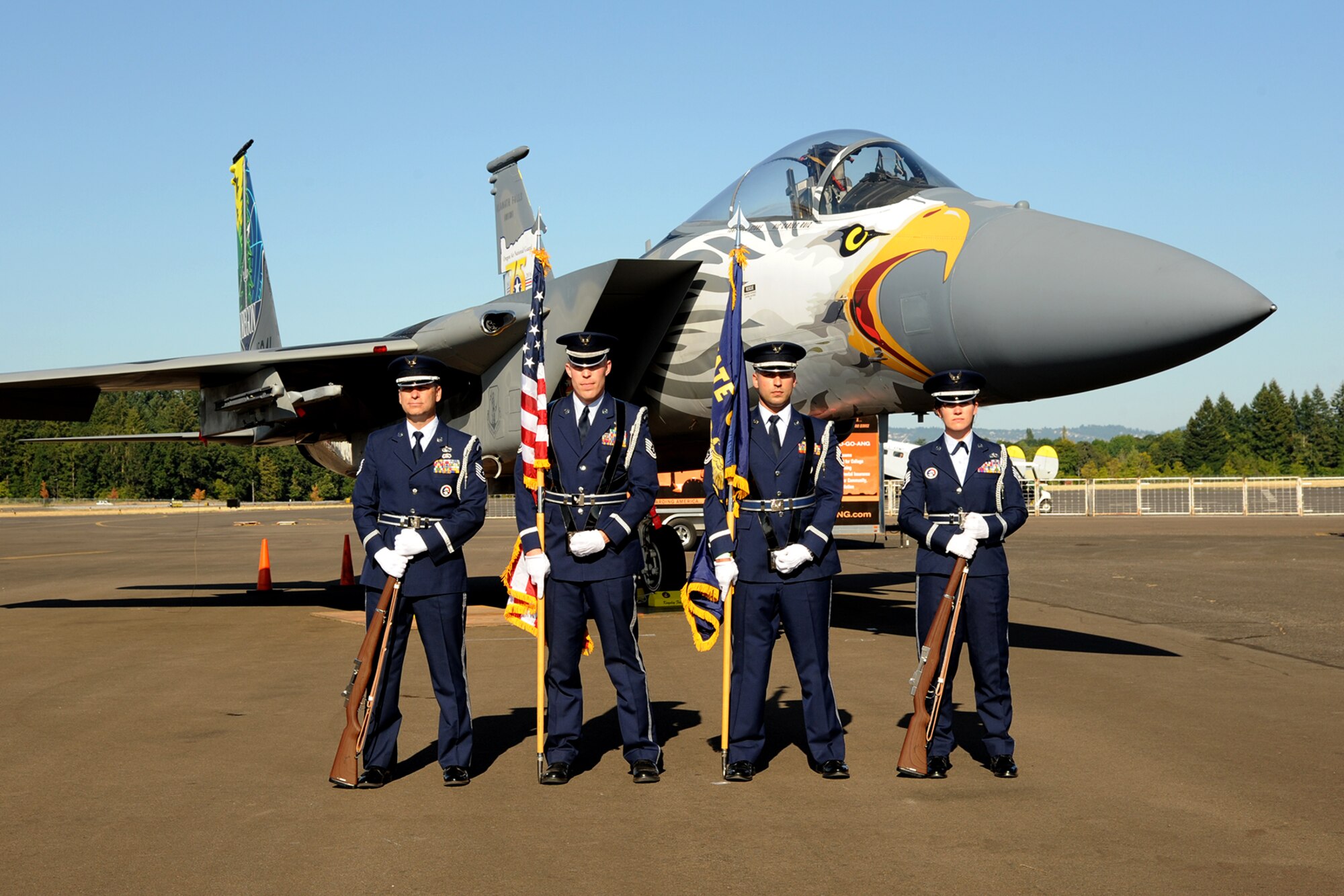 Members of the 142nd Fighter Wing Base Honor Guard team pose for a photograph with an Oregon Air National Guard F-15 Eagle assigned to the 173rd Fighter Wing at the Hillsboro International Airport, Ore., as part of the Oregon International Air Show, Aug. 6, 2016. The ‘Screaming Eagle’ paint designed is in recognition of the 75th Anniversary of the Oregon Air National Guard. (U.S. Air National Guard photo by Master Sgt. Shelly Davison, 142nd Fighter Wing Public Affairs/Released).