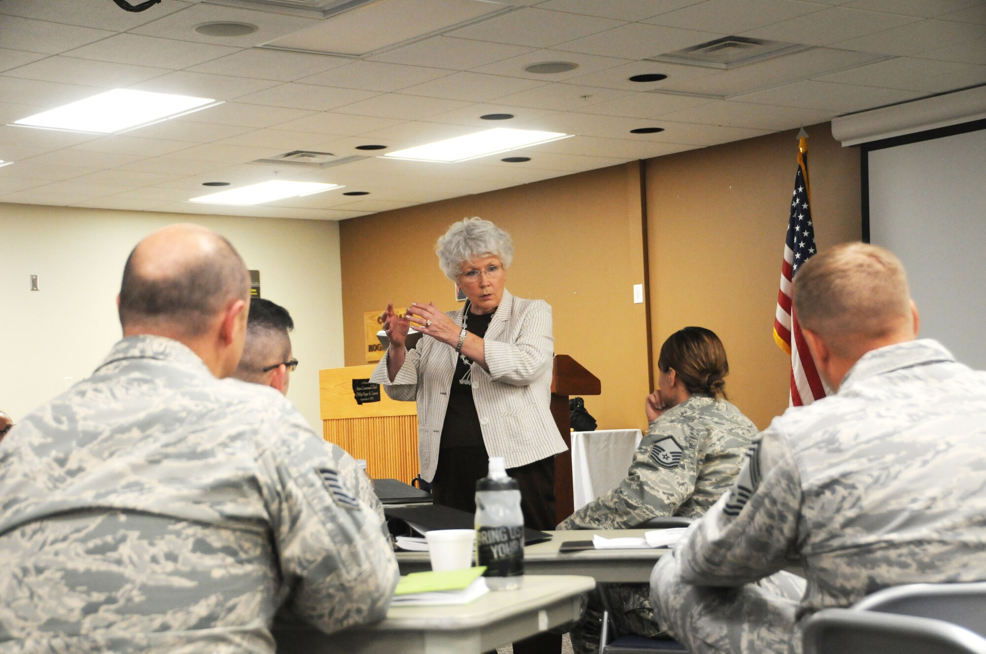 Maggie Bonner teaches flag etiquette to members of the 120th Airlift Wing in the Larsen Room of the 120AW Headquarters Building July 27, 2016. Bonner was teaching a protocol class for the Montana Air National Guard Airmen. (U.S. Air National Guard photo by Senior Master Sgt. Eric Peterson)