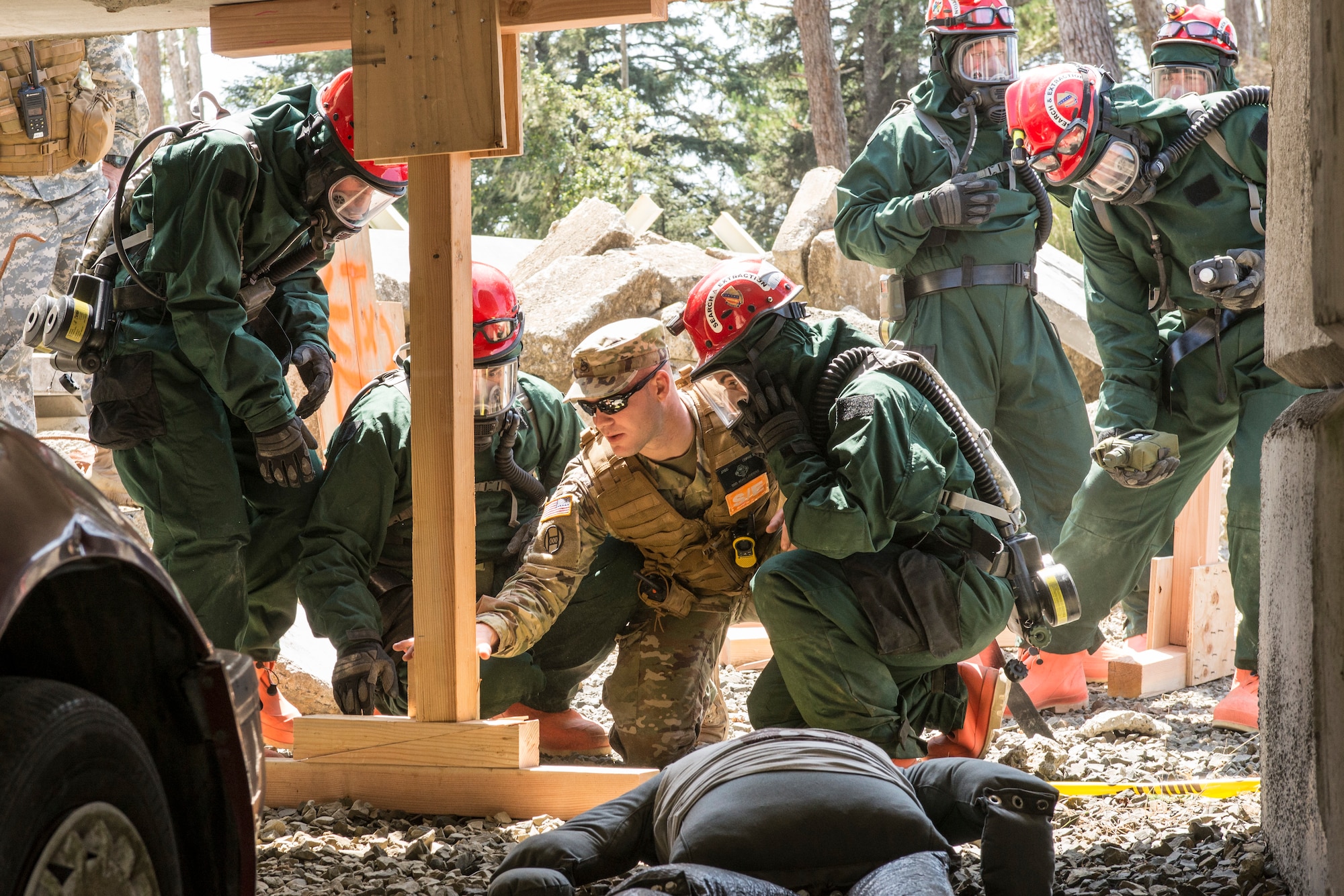 U.S. Army and Air Force Airmen and Soldiers, assigned to the search and extraction team (S&E), Colorado National Guard, train with an evaluator to build wood stabilizers under concrete tunnels and slabs to ensure the safety of S&E teams, when rescuing people from a simlulated chemical attack during a joint exercise evaluation (EXEVAL) at Camp Rilea, Warrenton, Oregon, on Aug. 3, 2016. The EXEVAL ran for five days in a crawl, walk, run sequence, where they started off slowly, then transitioned into rapid response on evaluation day. (U.S. Air National Guard photo by Staff Sgt. Bobbie Reynolds)