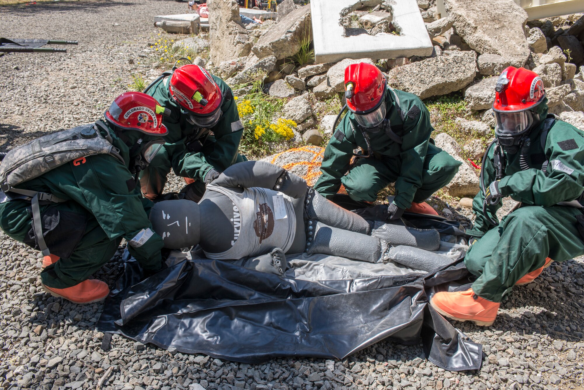 U.S. Colorado National Guard Airmen, assigned to the 140th Fatality Search and Reascue Team (FSRT), load the deceased, at Camp Rilea, Warrenton, Oregon, on Aug. 4, 2016. The FSRT is part of the Chemical, Biological, Radiological and Nuclear (CBRN) Enhanced Response Force Package (CERF-P) and functions as a recovery team, helping families find closure after properly identfying those who have lost their lives. (U.S. Colorado Air National Guard photo by Staff Sgt. Bobbie Reynolds) 