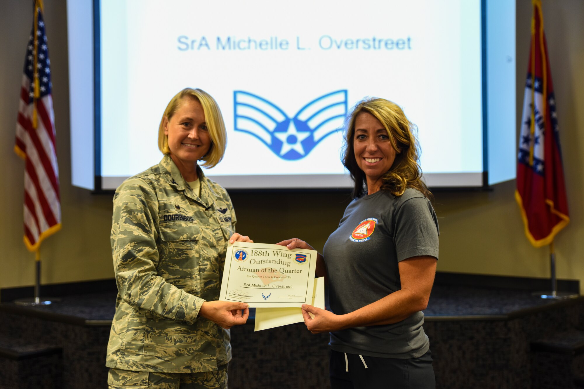 Staff Sgt. Michelle Overstreet, 188th Force Support Squadron, is named the 188th Outstanding Airman of the Quarter Aug. 6, 2016, for fiscal year 2016 quarter three at Ebbing Air National Guard Base, Fort Smith, Ark. The Outstanding Airman of the Quarter program promotes professional development, innovation and mission success by recognizing those who excel in their carrier fields while fostering the cultivation of ready, responsive and highly-skilled Airman. The award was presented to Overstreet by Col. Bobbi Doorenbos, 188th Wing commander. (U.S. Air National Guard photo by Senior Airman Cody Martin)
