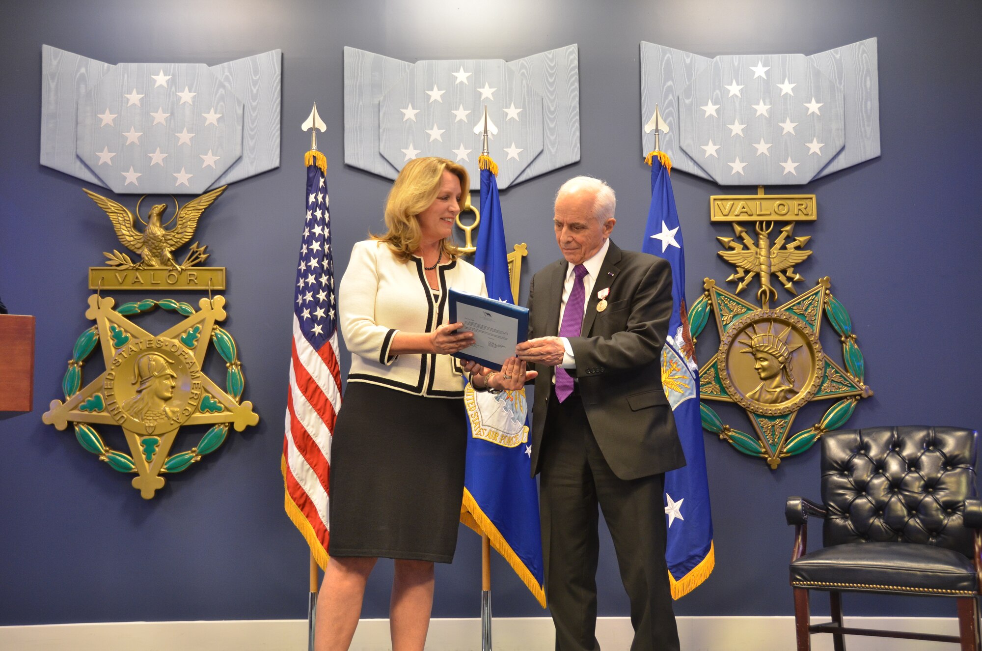 Deborah Lee James, Secretary of the Air Force, congratulates Anthony Duno for his 70 years of service during his retirement ceremony at The Pentagon. “I love to work on giving the United States something for the money we spent,” Duno said. (U.S. Air Force Photo/Steve Warns)