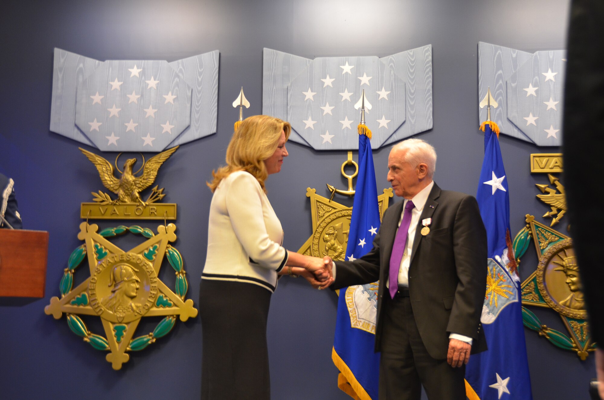 Deborah Lee James, Secretary of the Air Force, congratulates Anthony Duno for his 70 years of service during his retirement ceremony at The Pentagon. “You truly epitomize the core values of integrity first, service before self and excellence in all that we do,” James said. (U.S. Air Force Photo/Steve Warns)