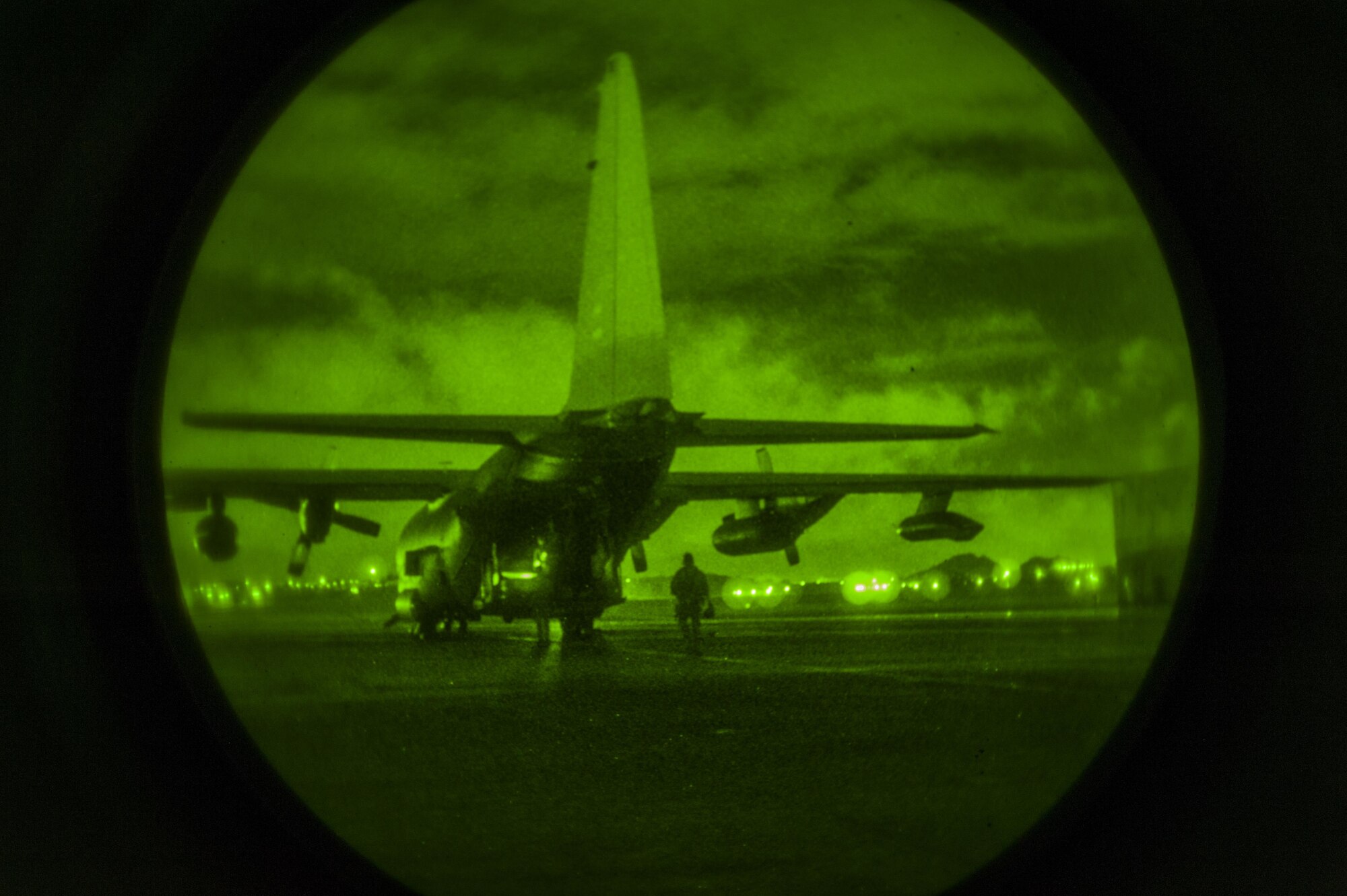 Airmen with the deployed aircraft ground response element board a C-130 Hercules on the flightline at Kadena Air Base, Japan Aug. 10, 2016. DAGRE was established in 2007 as a group of highly trained Security Forces personnel who support Special Operations Command assets and resources worldwide.  (U.S. Air Force Photo by Airman 1st Class Nick Emerick)