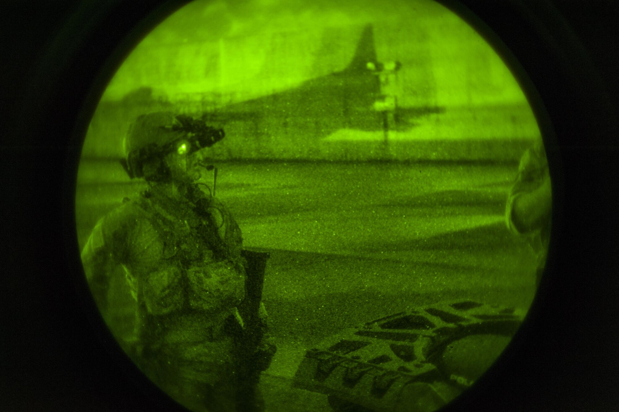 A member of the deployed aircraft ground response element tests his night-vision goggles prior to an exercise on the flightline at Kadena Air Base, Japan, Aug. 10, 2016. In the 2015 fiscal year, the 353rd Special Operations Support Squadron DAGRE unit trained for more than 400 hours.  (U.S. Air Force Photo by Airman 1st Class Nick Emerick)