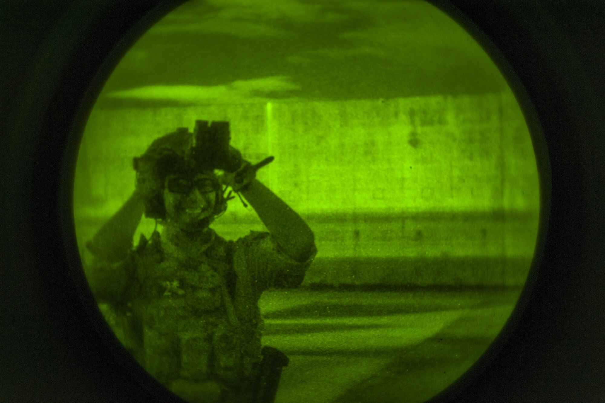 A member of the deployed aircraft ground response element checks his equipment prior to an exercise on the flightline at Kadena Air Base, Japan Aug. 10, 2016. As part of constant mission readiness, the annual training requirement for the DAGRE is 216 hours. (U.S. Air Force Photo by Airman 1st Class Nick Emerick)