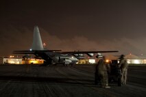 A 1st Special Operations Squadron MC-130H Combat Talon II idles on the flight line as 18th Logistics Readiness Squadron forward area refueling point members deploy a forward area manifold cart during a FARP exercise Aug. 10, 2016, at Kadena Air Base, Japan. Combining the versatility of Combat Talon II’s and FARP teams enables forward deployed aircraft to refuel anywhere, anytime.  (U.S. Air Force photo by Senior Airman Peter Reft)