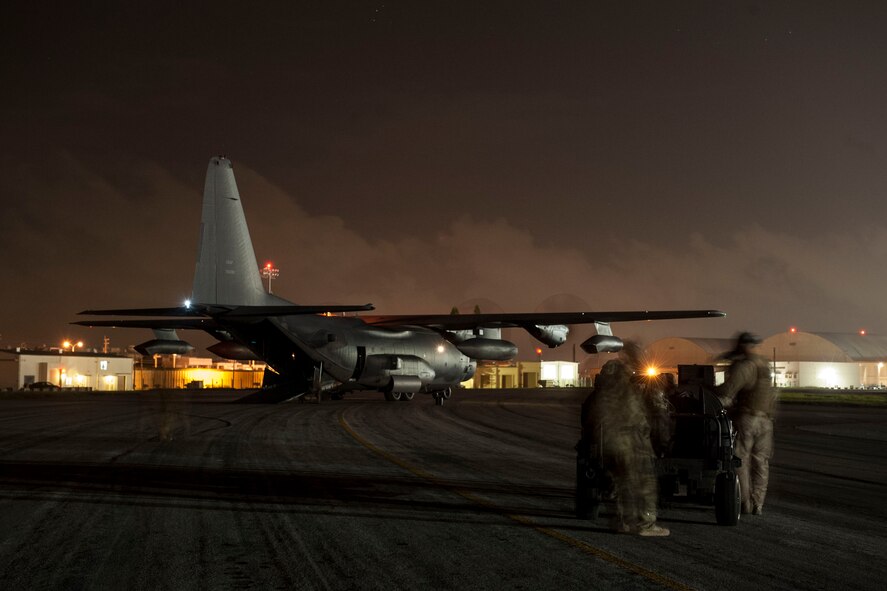 A 1st Special Operations Squadron MC-130H Combat Talon II idles on the flight line as 18th Logistics Readiness Squadron forward area refueling point members deploy a forward area manifold cart during a FARP exercise Aug. 10, 2016, at Kadena Air Base, Japan. Combining the versatility of Combat Talon II’s and FARP teams enables forward deployed aircraft to refuel anywhere, anytime.  (U.S. Air Force photo by Senior Airman Peter Reft)