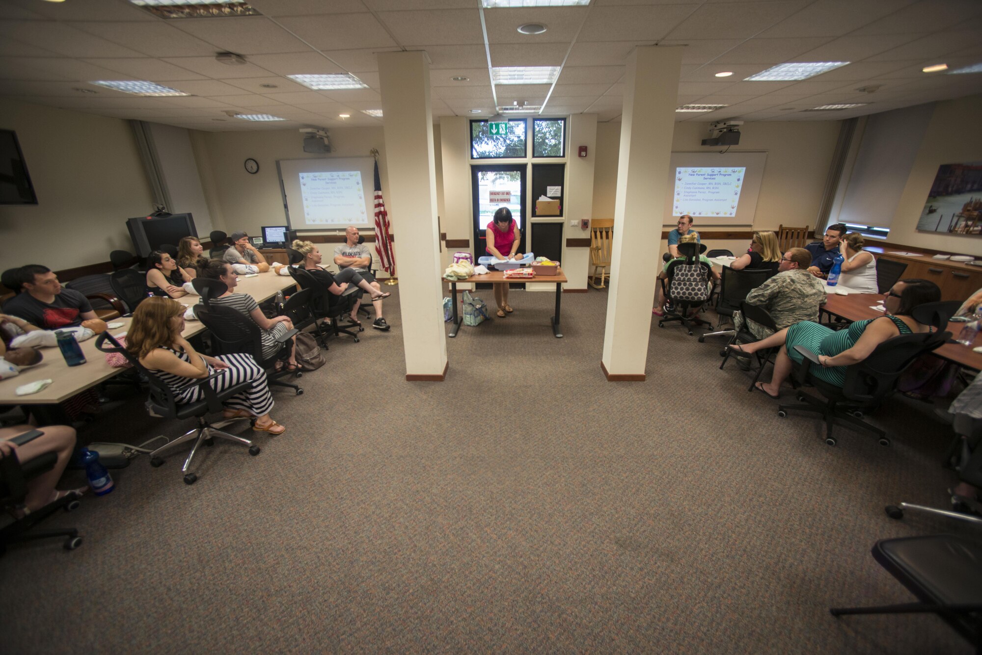 Cynthia Cusimano, 31st Medical Operations Squadron Family Advocacy nurse, teaches Baby Basic Training students how to bathe an infant on August 4, 2016, at Aviano Air Base, Italy. The two-part class teaches expecting parents about basic care and safety for infants, child development and the importance of breastfeeding. (U.S. Air Force photo by Senior Airman Krystal Ardrey/Released)