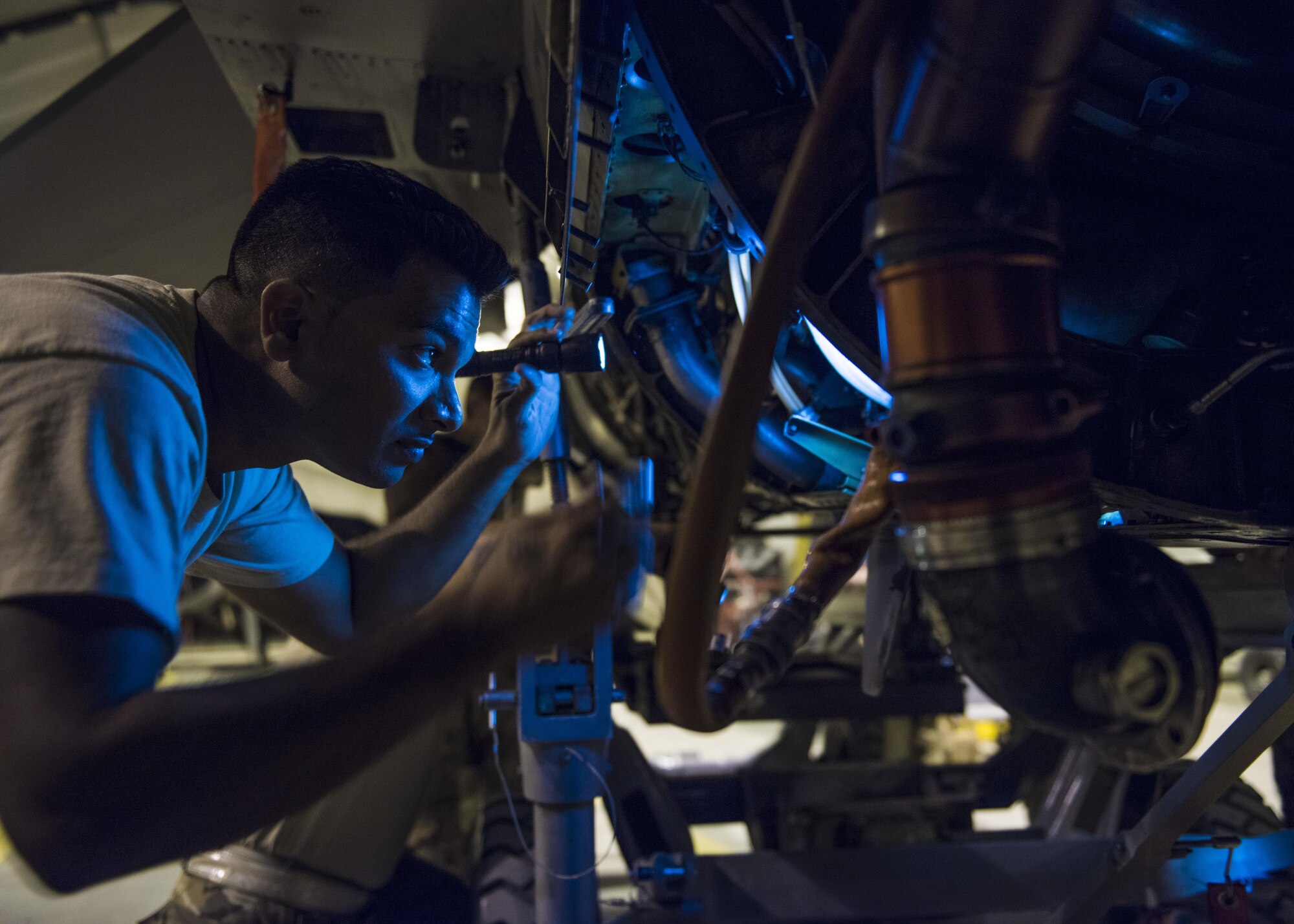 Tech. Sgt. Brijesh Seepersab, 455th Expeditionary Aircraft Maintenance Squadron F-16C Fighting Falcon crew chief, installs an engine on an F-16C Fighting Falcon, Bagram Airfield, Afghanistan, Aug. 9, 2016. During installation, crew chiefs carefully guide the engine into place, making sure it is aligned properly and not hitting electrical wires. (U.S. Air Force photo by Senior Airman Justyn M. Freeman)