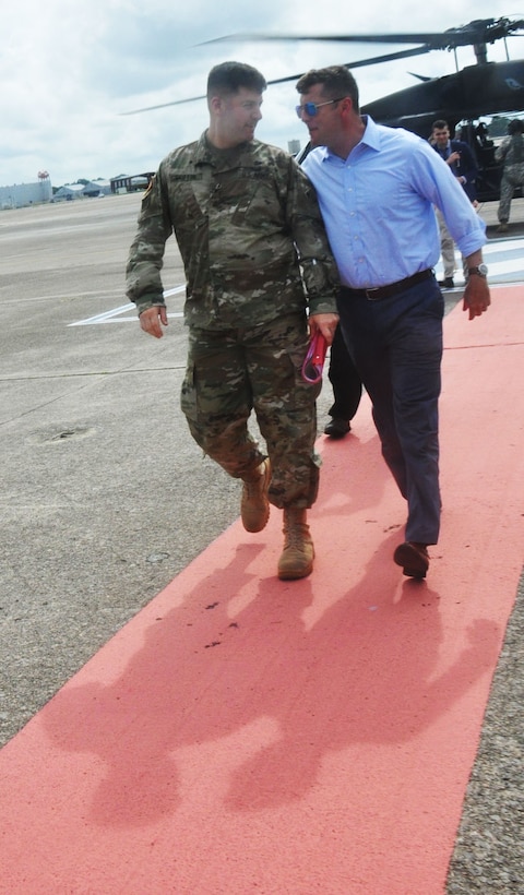 Col. Marvin Griffin, commander of the Savannah District, U.S. Army Corps of Engineers, accompanies Undersecretary of the Army Patrick Murphy after a helicopter tour of the Savannah harbor on Aug. 11, 2016. Murphy took an aerial tour of the harbor as part of his visit to Fort Stewart and Hunter Army Airfield in Georgia. The Savannah District is responsible for maintaining the Savannah harbor and is in the process of deepening it an additional 5 feet to better accommodate larger, post-Panamax container ships, as part of the Savannah Harbor Expansion Project (SHEP). 