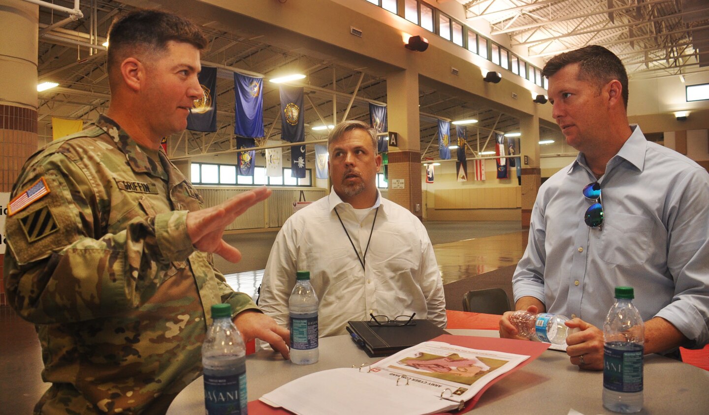Col. Marvin Griffin, commander of the Savannah District, U.S. Army Corps of Engineers (left) and Spencer Davis, a project manager for the Savannah District, update Undersecretary of the Army Patrick Murphy (right) on the Savannah Harbor Expansion Project. The SHEP will deepen the harbor an additional 5 feet to better accommodate larger, post-Panamax container ships. 
