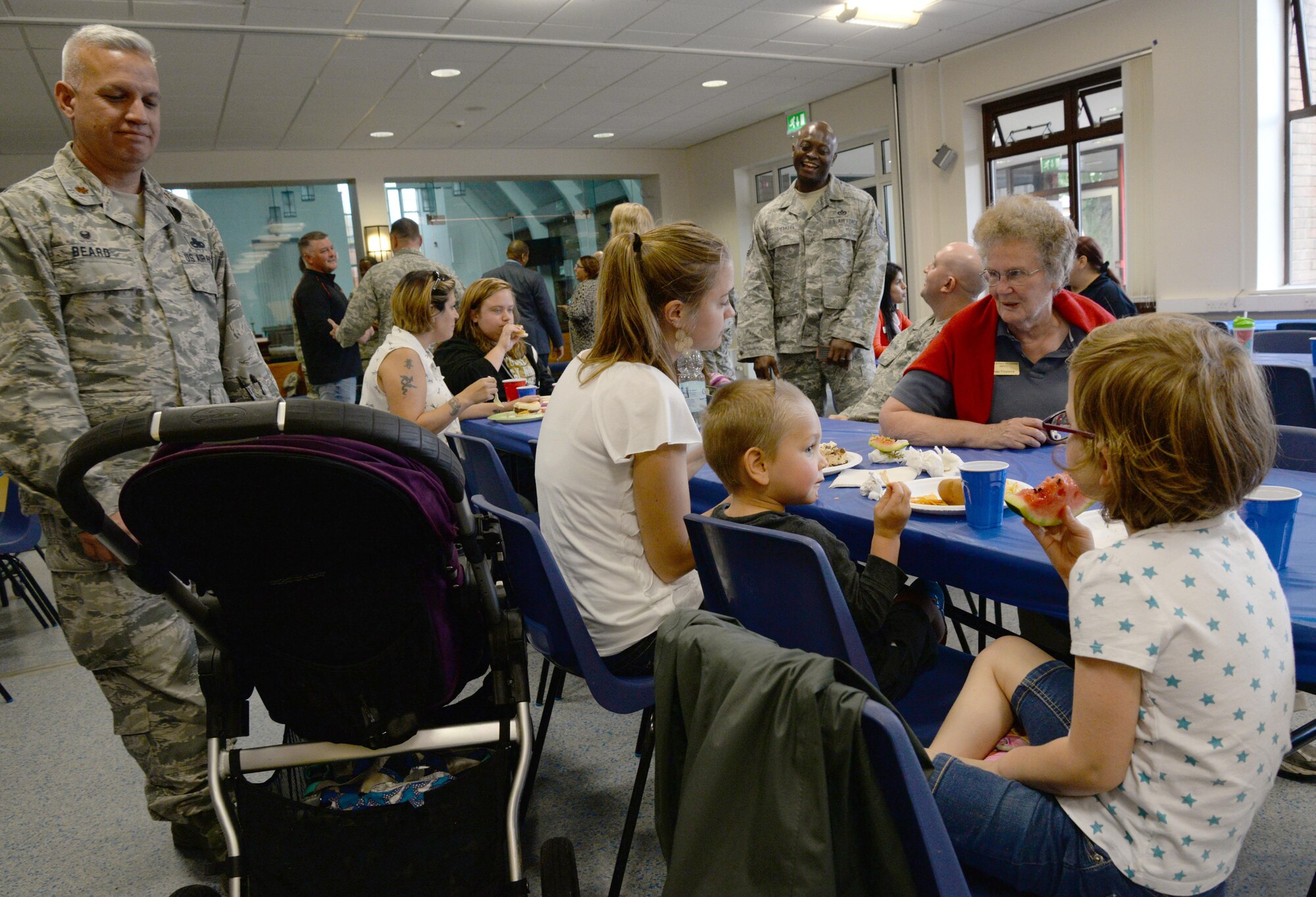 Families of deployed military members socialize over dinner at the Aug. Hearts Apart event hosted by the 351st Air Refueling Squadron Aug. 11, 2016, on RAF Mildenhall, England. The event’s intent is to bring together and show support for families of deployed military. (U.S. Air Force photo by Senior Airman Justine Rho)
