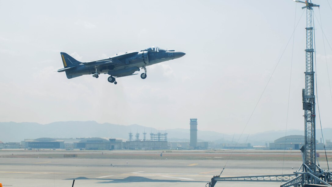 A U.S. Marine Corps AV-8B Harrier with Marine Attack Squadron 542 performs a vertical landing while using the lights on the mobile Expeditionary Hover Position Indicator to adjust its position at Marine Corps Air Station Iwakuni, Japan, Aug. 9, 2016. VMA-542 is home based out of Marine Corps Air Station Cherry Point, N.C., and is forward deployed to MCAS Iwakuni, Japan, as part of the unit deployment program. The Harrier pilots used the mobile EHPI in coordination with Aircraft Recovery assigned to Headquarters and Headquarters Squadron to recertify on boat-deck landings to prepare for other future operations in the Pacific. 