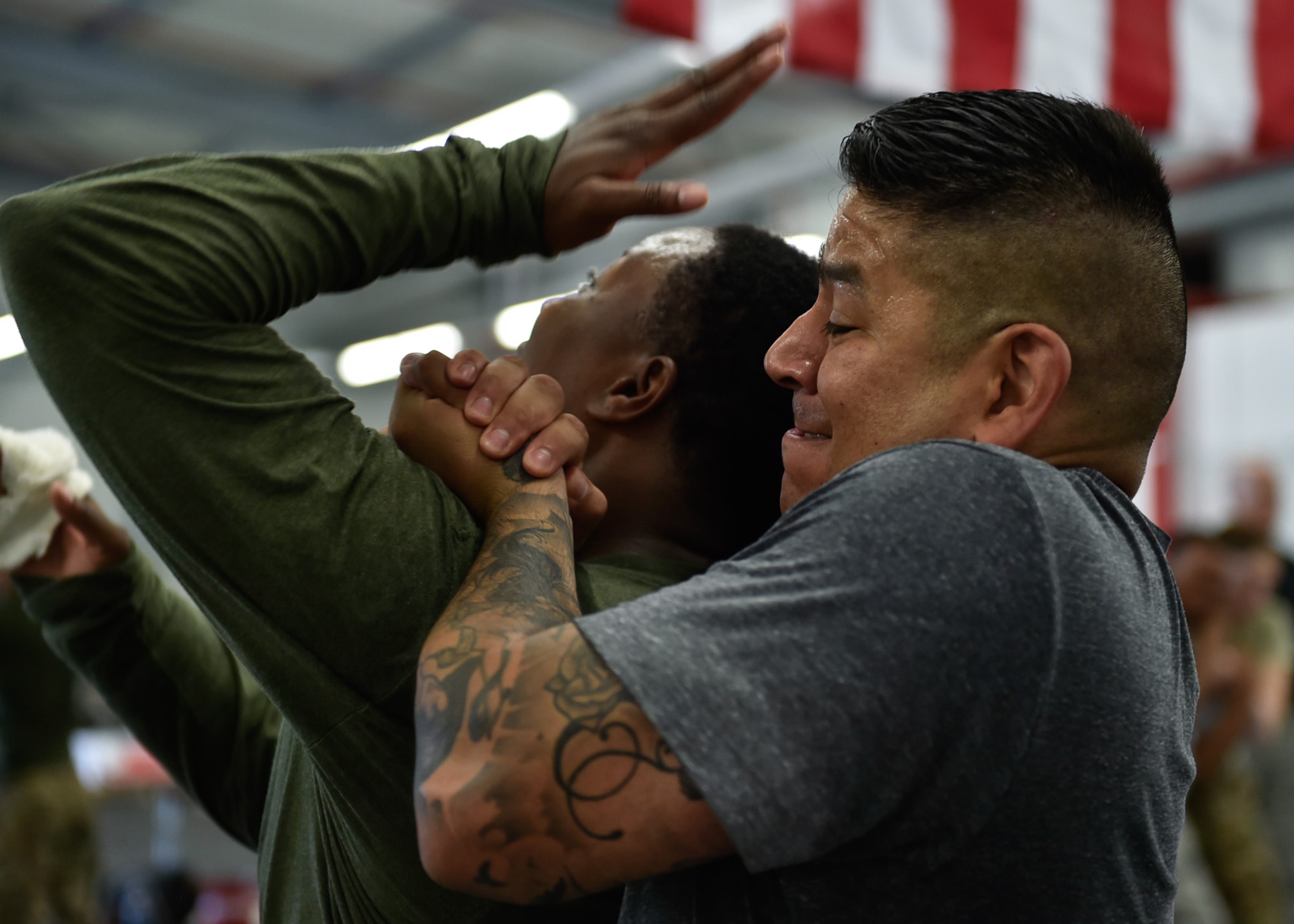 U.S. Air Force Master Sgt. Anthony Sanchez,
569th U.S. Forces Police Squadron NCO in charge of training, holds U.S. Air Force Staff Sgt. LaDonna Winston, 435 Security Forces Squadron ground regional training center instructor, in a tight grip August 4, 2016, at Ramstein Air Base, Germany. Students practiced different techniques to be better prepared for an attack. (U.S. Air Force photo/Airman 1st Class Savannah L. Waters)

