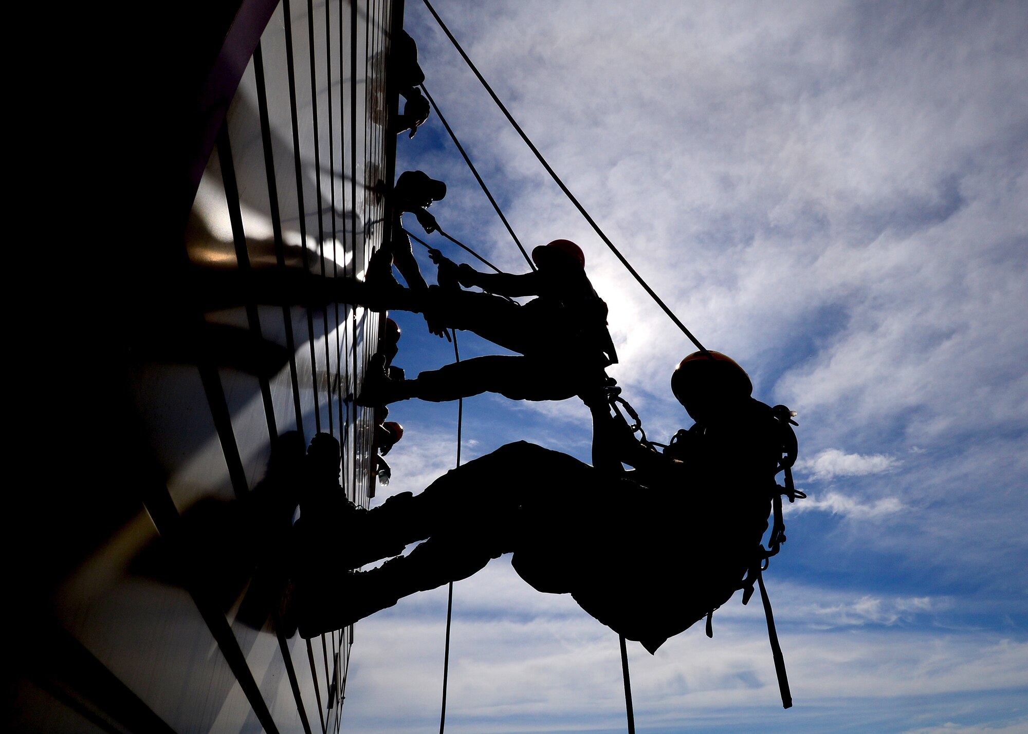 Firefighters from the 31st Civil Engineer Squadron rappel down the side of a building during a Rescue Technician One course at Aviano Air Base, Italy, Aug. 8, 2016. Fourteen Aviano firefighters participated in the training to learn how to conduct low angle, high angle and confined space rescues. (U.S. Air Force photo/Senior Airman Areca T. Bell)