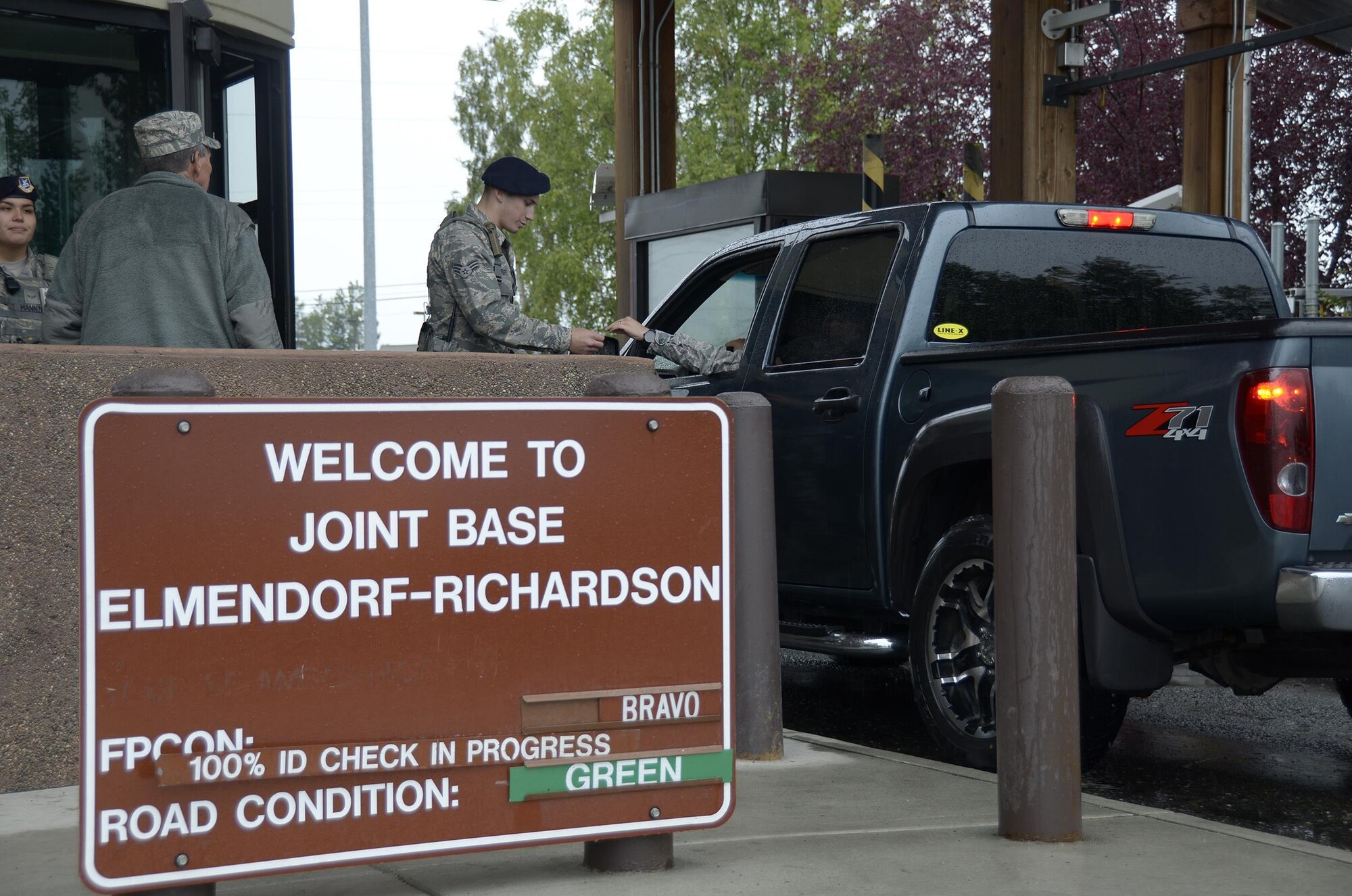 Senior Airman Joshua Huber, a defender with the 445th Security Forces Squadron, Wright-Patterson Air Force Base, Ohio, checks the identification card of an individual passing through an entry point here July 25, 2016. Reservists from the 445th SFS worked alongside the 673rd Security Forces Squadron during their annual tour. (U.S. Air Force photo/Staff Sgt. Joel McCullough)