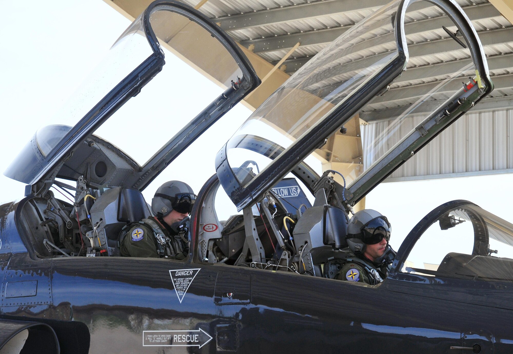 U.S. Air Force Maj. Michael Granberry, the 394th Combat Training Squadron T-38 Talon assisted director of operations of the Companion Trainer Program (right) and Capt. William Jensen, a pilot assigned to the 394th Combat Training Squadron, prepare for takeoff in a T-38 Talon aircraft at Whiteman Air Force Base, July 12, 2016. Pilots must fly the required amount of sorties a month to maintain combat mission ready status. 