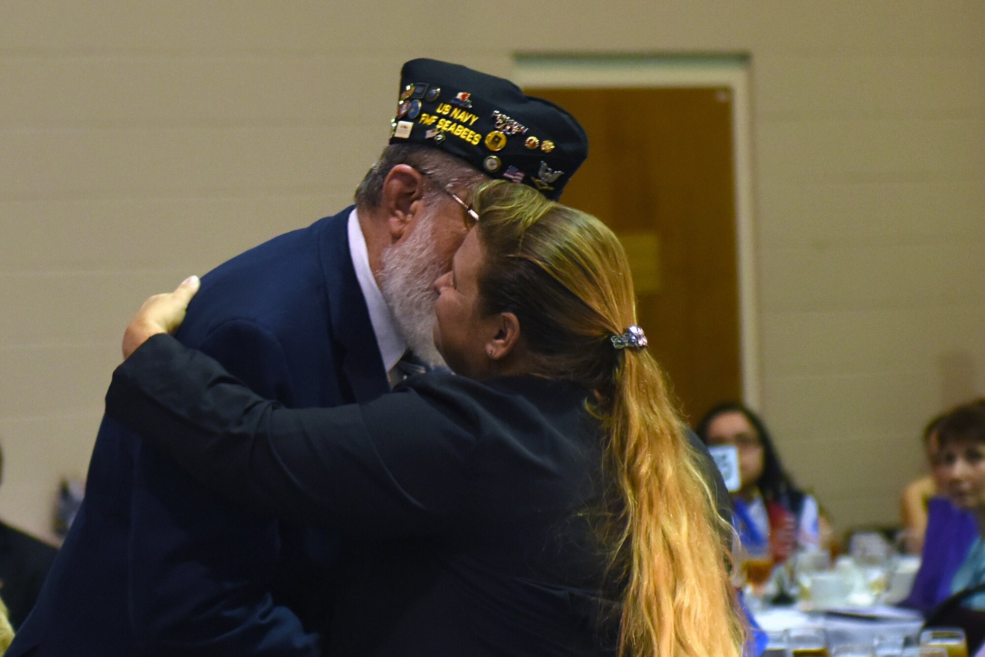 Military veterans distributed a rose to family members of each Purple Heart recipient who died or went missing in action during a banquet Aug. 5, 2016, in Goldsboro, North Carolina. Team Seymour members attended the banquet to show support and respect to the veterans. (U.S. Air Force photo/Airman 1st Class Ashley Williamson)