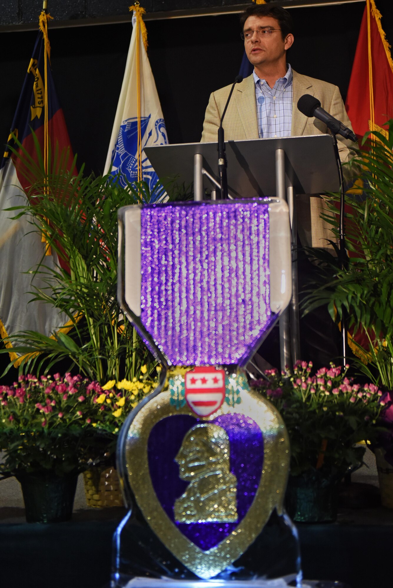 Ilario Pantano, Programs and Services Institute for Veterans and Military Families senior director, discusses how military members are family during a Purple Heart dinner, Aug. 5, 2016, in Goldsboro, North Carolina. Several members of Team Seymour attended or volunteered at the banquet in support of their fellow wingmen. (U.S. Air Force photo/Airman 1st Class Ashley Williamson)