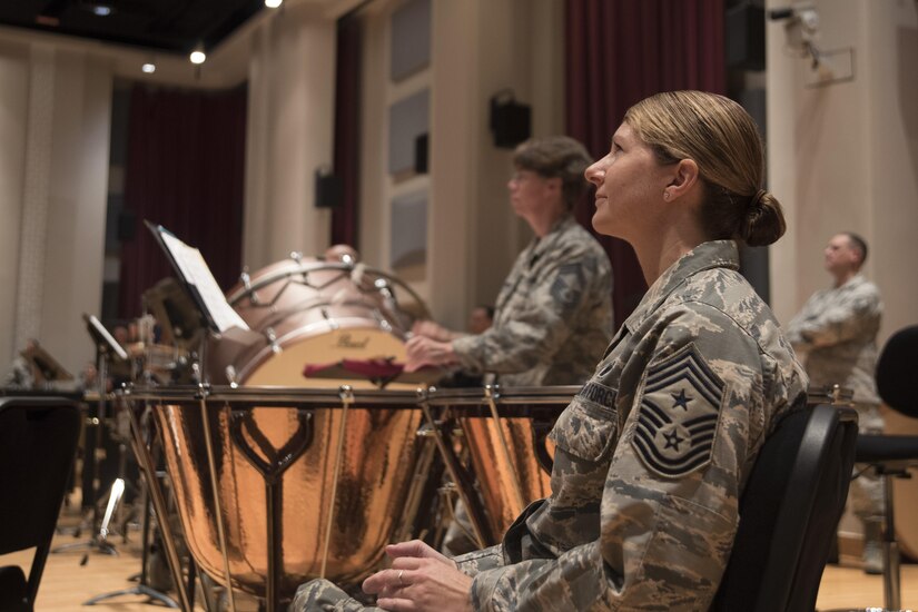 Chief Master Sergeant Beth Topa, 11th Wing command chief master sergeant, listens to a performance by the U.S. Air Force Concert Band during an immersion tour at Joint Base Anacostia-Bolling in Washington, D.C., Aug. 9, 2016. The purpose of the visit was for Col. E. John Teichert, 11th WG and Joint Base Andrews commander, and Topa to become more familiar with the U.S. Air Force Band and Honor Guard missions. (U.S. Air Force Photo by Airman 1st Class Rustie Kramer)