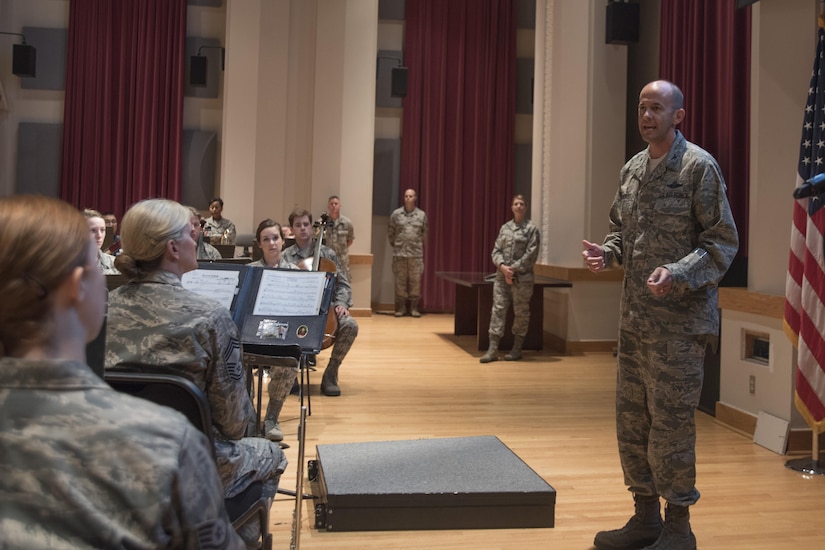 Col. E. John Teichert, 11th Wing and Joint Base Andrews commander speaks to members of the U.S Air Force Concert Band during a commander’s call at Joint Base Anacostia-Bolling in Washington, D.C., Aug. 9, 2016. The purpose of the visit was for Teichert and Chief Master Sgt. Beth Topa, 11th WG command chief master sergeant, to become more familiar with the U.S Air Force Band and Honor Guard missions. (U.S. Air Force Photo by Airman 1st Class Rustie Kramer)