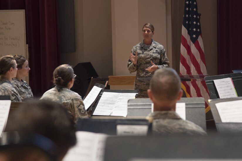 Chief Master Sergeant Beth Topa, 11th Wing command chief master sergeant, speaks to members of the U.S. Air Force Concert Band during an immersion tour at Joint Base Anacostia-Bolling in Washington, D.C., Aug. 9, 2016. The purpose of the visit was for Col. E. John Teichert, 11th WG and Joint Base Andrews commander, and Topa to become more familiar with the U.S. Air Force Band and Honor Guard missions. (U.S. Air Force Photo by Airman 1st Class Rustie Kramer)