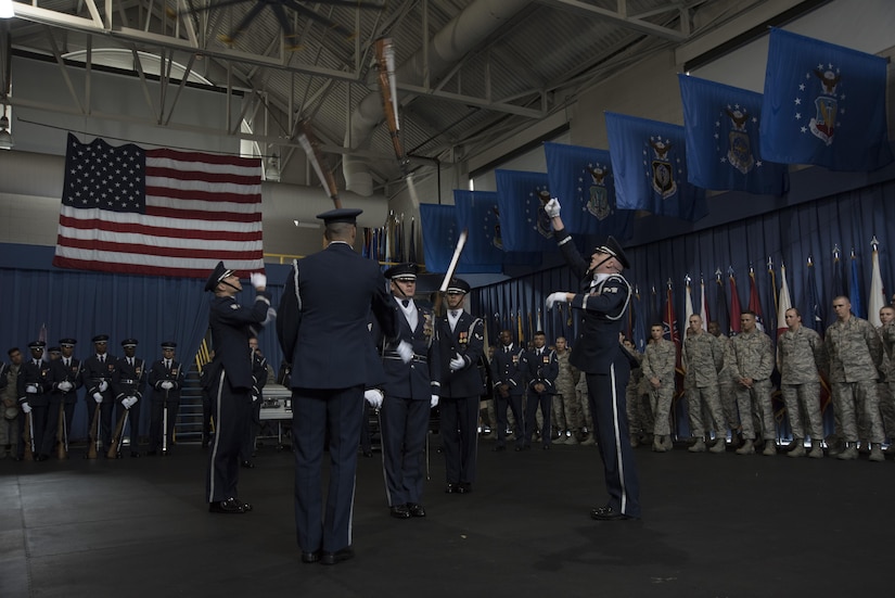 Members of the U.S. Honor Guard Drill Team perform a four-man routine at Joint Base Anacostia-Bolling in Washington, D.C., Aug. 9, 2016. The performance was part of an immersion tour attended by Col. E. John Teichert, 11th Wing and Joint Base Andrews Commander, and Chief Master Sgt. Beth Topa, 11th WG command chief master sergeant, to become more familiar with the U.S. Air Force Band and Honor Guard missions. (U.S. Air Force photo by Airman 1st Class Rustie Kramer)   