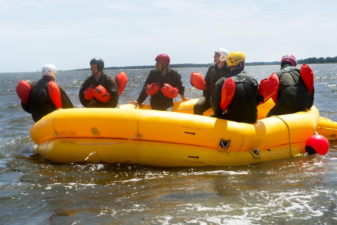 Airmen wait in a raft before participating in a helicopter extraction during water survival training at Bowers Beach, Del., Aug. 6, 2016. Air Force photo by Tech. Sgt. Nathan Rivard