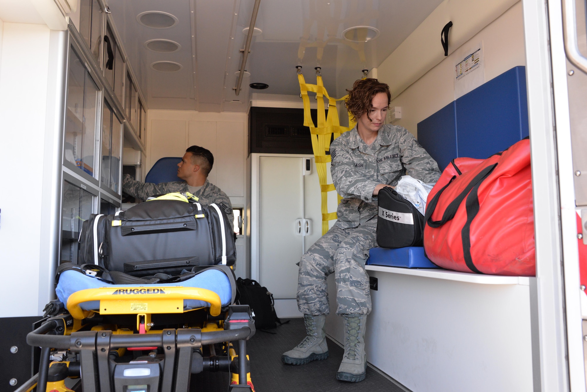 Staff Sgt. Emily Overcash and Staff Sgt. Benny Algarin, 60th Aerospace Medicine Squadron operational medical technicians, perform item inspections at Travis Air Force Base, California, Aug. 1, 2016. Operational medical technicians respond to inflight emergencies and take care of flyers. They also handle profiles, retraining, separations and medical evaluation boards for non-flyers. (U.S. Air Force photo by Senior Airman Amber Carter)