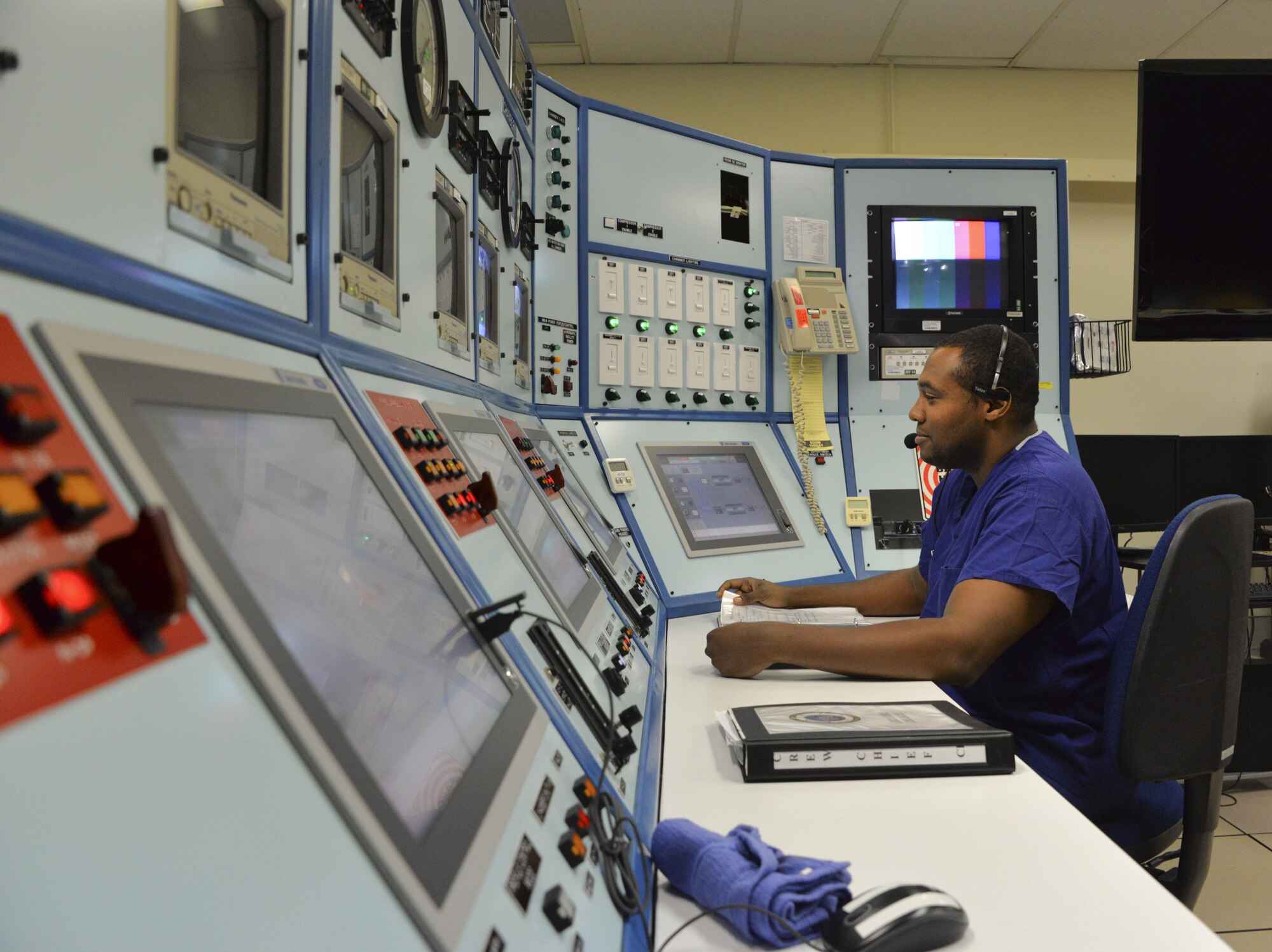 Staff Sgt. Michael Lloyd, 60th Aerospace Medicine Squadron hyperbaric chamber NCO in-charge, operates a console at Travis Air Force Base, Calif., Aug. 1, 2016. The console controls the three hyperbaric chambers and monitors patients during treatment. (U.S. Air Force photo Senior Airman Amber Carter)