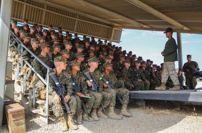 Recruits from Fox Company, 2nd Recruit Training Battalion, receive instruction a primary marksmanship instructor during Grass Week at Edson Range, Weapons and Field Training Battalion, Marine Corps Base Camp Pendleton, Calif., Aug. 3. The recruits participated in classes taught by their PMIs, and they learned more about handling their weapon and what they’ll be doing with it for the weeks to come. Annually, more than 17,000 males recruited from the Western Recruiting Region are trained at MCRD San Diego. Fox Company is scheduled to graduate Sep. 23.
